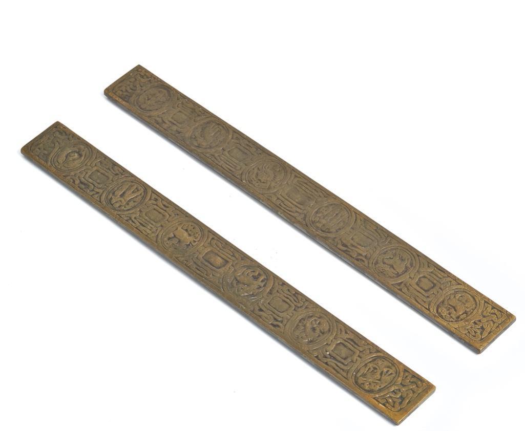 Pair of Tiffany Studios, New York, Bronze Blotter Pad Ends in the Zodiac Pattern: Pair of Tiffany Studios, New York, Bronze Blotter Pad Ends in the Zodiac Pattern Pair of Tiffany Studios, early 20th century bronze blotter pad ends/desk accessory in the zodiac pattern. Marked Tiffan