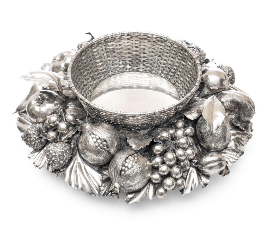 Buccellati extraordinary large Silver centerpiece, Signed: Extraordinary Signed Gianmaria Buccellati Fruit & Foliate Silver CenterpieceSubstantial Gianmaria Buccellati silver centerpiece bowl having woven circular basket centered by sculpted silver fruit and