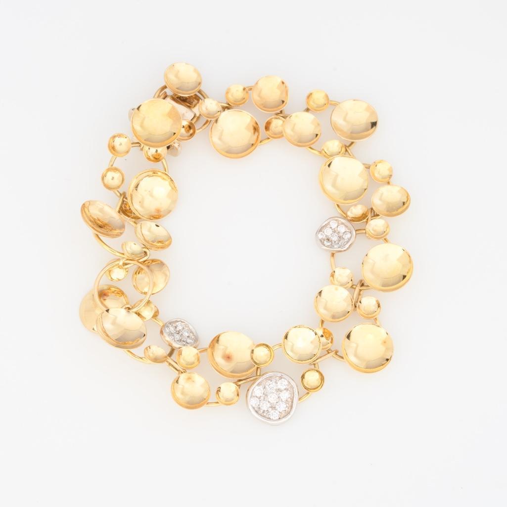 Orlando Orlandini Signed Italian Gold and Diamond Roundel Bracelet: Orlando Orlandini Signed Italian Gold and Diamond Roundel Bracelet18k yellow gold bracelet with slide-in clasp and safety clip-in catch, fashioned with various sized convex roundels with polished fini