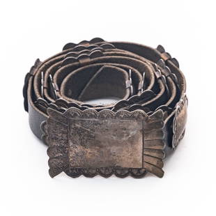 Antique Native American Sterling Silver and Leather belt: Antique Native American Sterling Silver and Leather belt probably navajo or hopi work. Men's or Women's and can easily be cut down for size. Antique Native American Sterling Silver and Leather concho