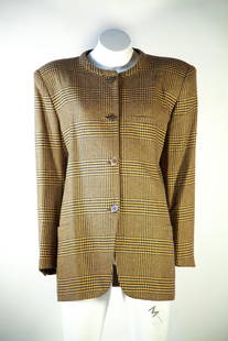 Loro Piana four-button, blazer: Loro Piana Four-Button Blazer This Loro Piana jacket is crafted from a luxurious wool cashmere blend, featuring a classic yellow and black houndstooth design. Shoulder pads add structure and