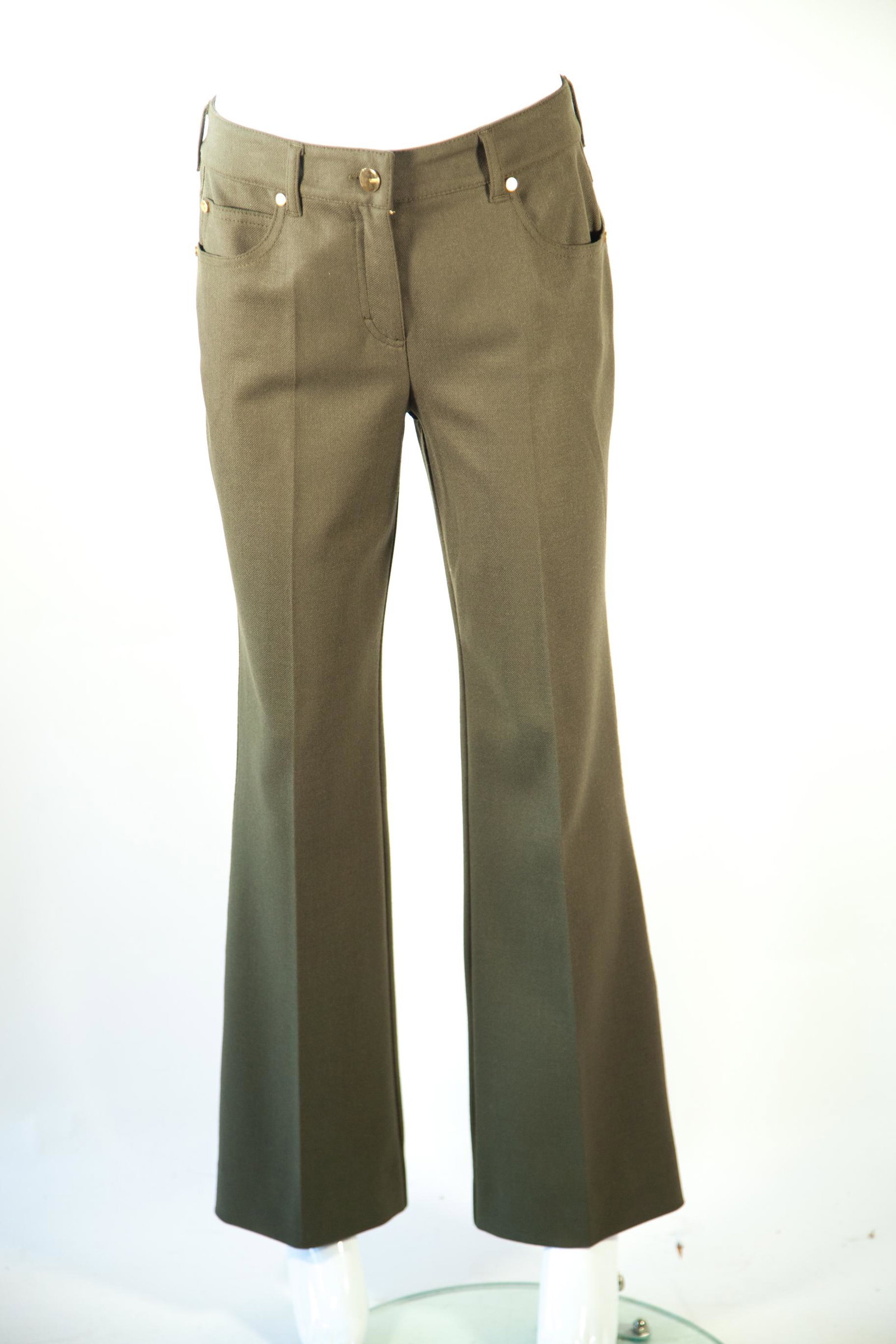 Escada Green Pant with Gold Tone Hardware: Escada Green Pant with Gold Tone HardwareEscada pants are crafted with premium green virgin wool and a mild flare that ensures a comfortable fit, ideal for everyday wear. The wool's softness and breat