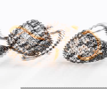 Vintage Pair 18K Gold Bead Set Black and White Diamond Earrings: Vintage Pair 18K Gold Bead Set Black and White Diamond EarringsVintage pair of 18K gold hinged omega post curved earrings featuring bead set black and white diamonds. The white diamonds are VS clarity