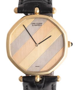 Van Cleef & Arpels 18K Gold Automatic Wristwatch, Circa 1990 With a size of 32mm: Van Cleef & Arpels 18K Gold Automatic Wristwatch, Circa 1990A sophisticated 18K gold automatic wristwatch designed by Gerald Genta for Van Cleef & Arpels. This stylish timepiece, with reference number