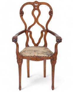 Exceptional hand carved Art Nouveau Arm Chair circa 1900: Exceptional Art Nouveau Mahogany Arm Chair Circa 1900. Hand Carved Fruitwood with Velvet Upholstery. (Single Chair). The chair of curvilinear design is carved with leaves and fruit motifs 42.75" H x 2