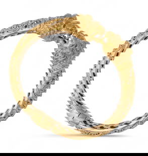Ilias Lalaounis or Zolotas 18K Yellow Gold Lion Chimera Bangle Bracelet: Ilias Lalaounis or Zolotos 18K Yellow Gold Lion Chimera Bangle Bracelet With opening branches, it is chiseled with ornamental patterns, ending with two facing lion heads. Total gross weight: 35.