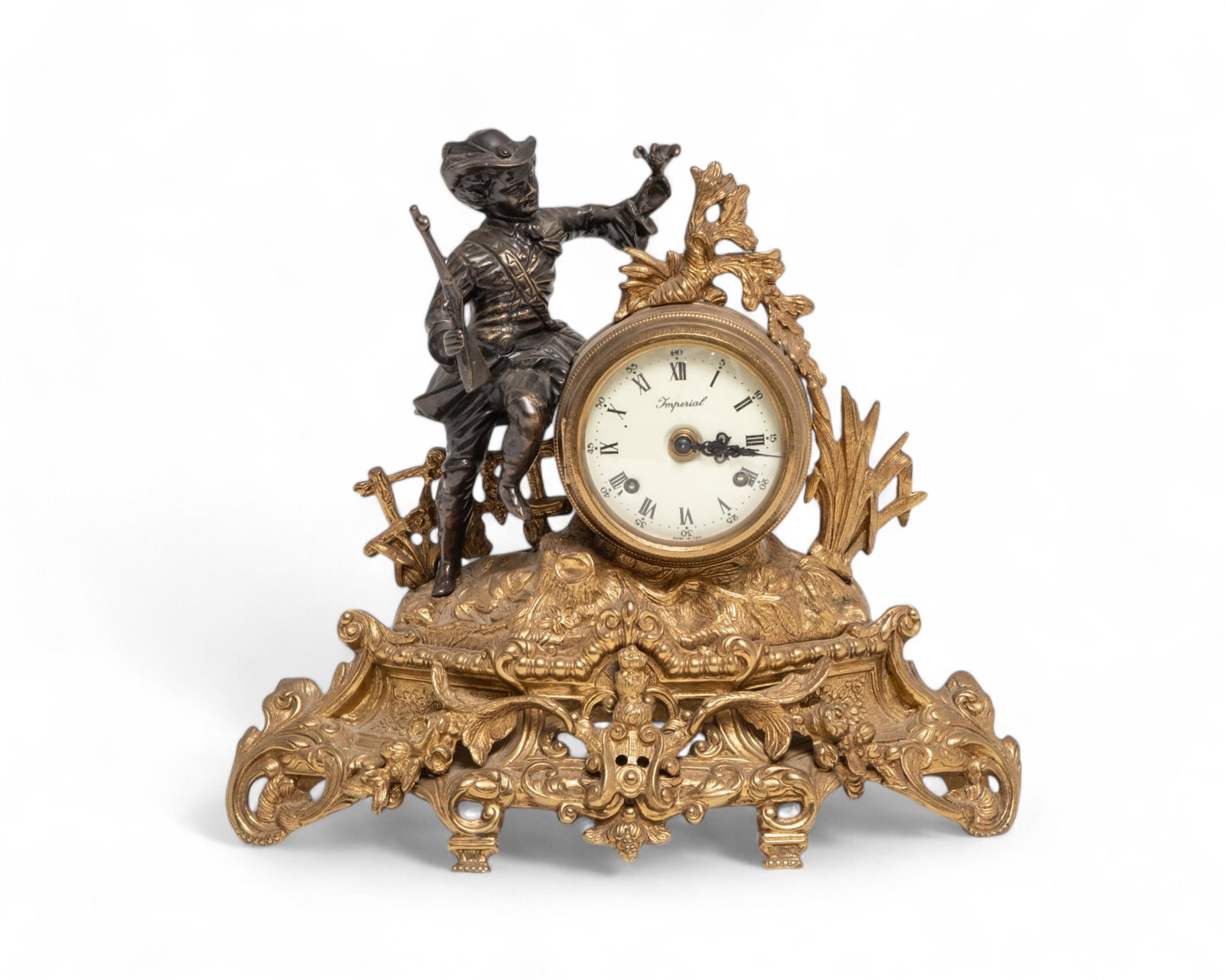 Imperial Brevettato Italian Gilded Brass and Bronze Hunter Clock, 1920: Keywords: gilded brass clock, bronze clock, hunter decoration, 1920s clock, Italian clock, Brevettato, collectible clocks, antique clocksGilded brass and bronze clock featuring a detailed hunter motif