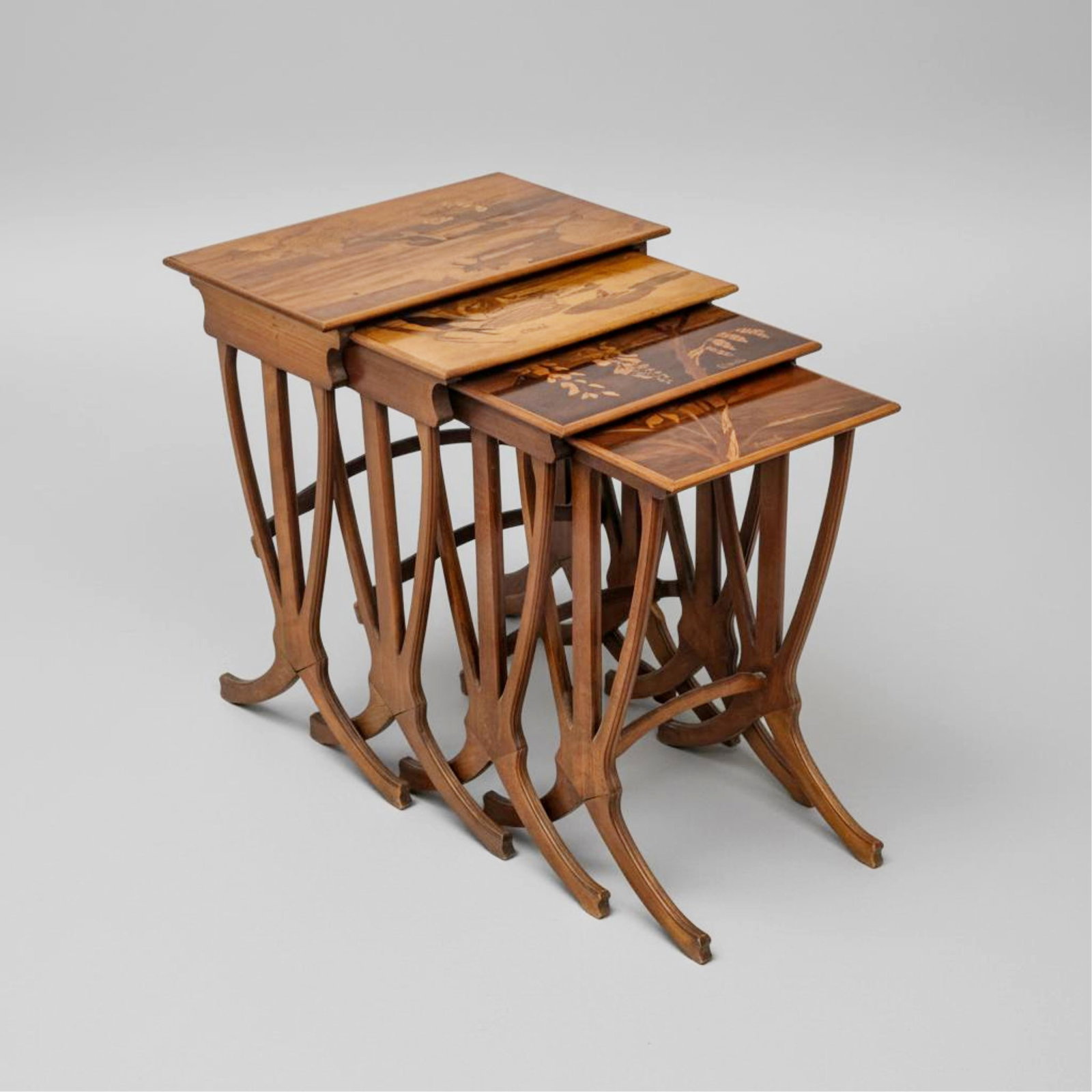 Gallé Signed Art Nouveau Set of Four Marquetry Nesting Tables, Early 20th Century: Keywords; Art Nouveau furniture, marquetry, nesting tables, wood inlay, floral marquetry, French decorative arts, hydrangea, water lily, daffodil, wisteria, frog motif, signed GalléSigned Gallé Art