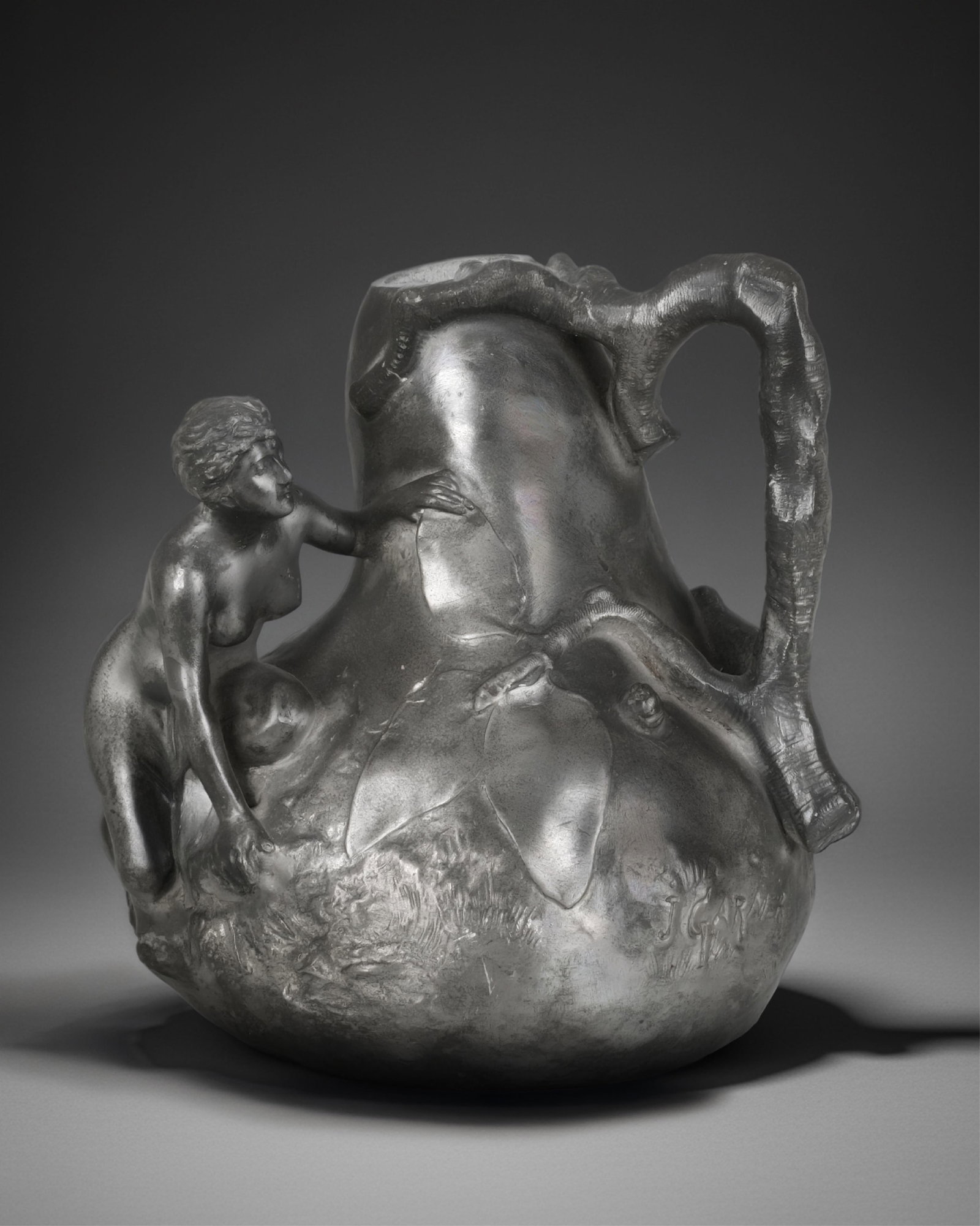 Signed Jean Garnier French Art Nouveau Pewter Pitcher, c.1900 E. Fres Maker's Mark: Keywords: French Belle Epoque, nude nymph figure, naturalistic decoration, early 20th-century metalware, continental decorative arts, centerpiece, art nouveau, art deco,Jean Garnier (18531910) signed