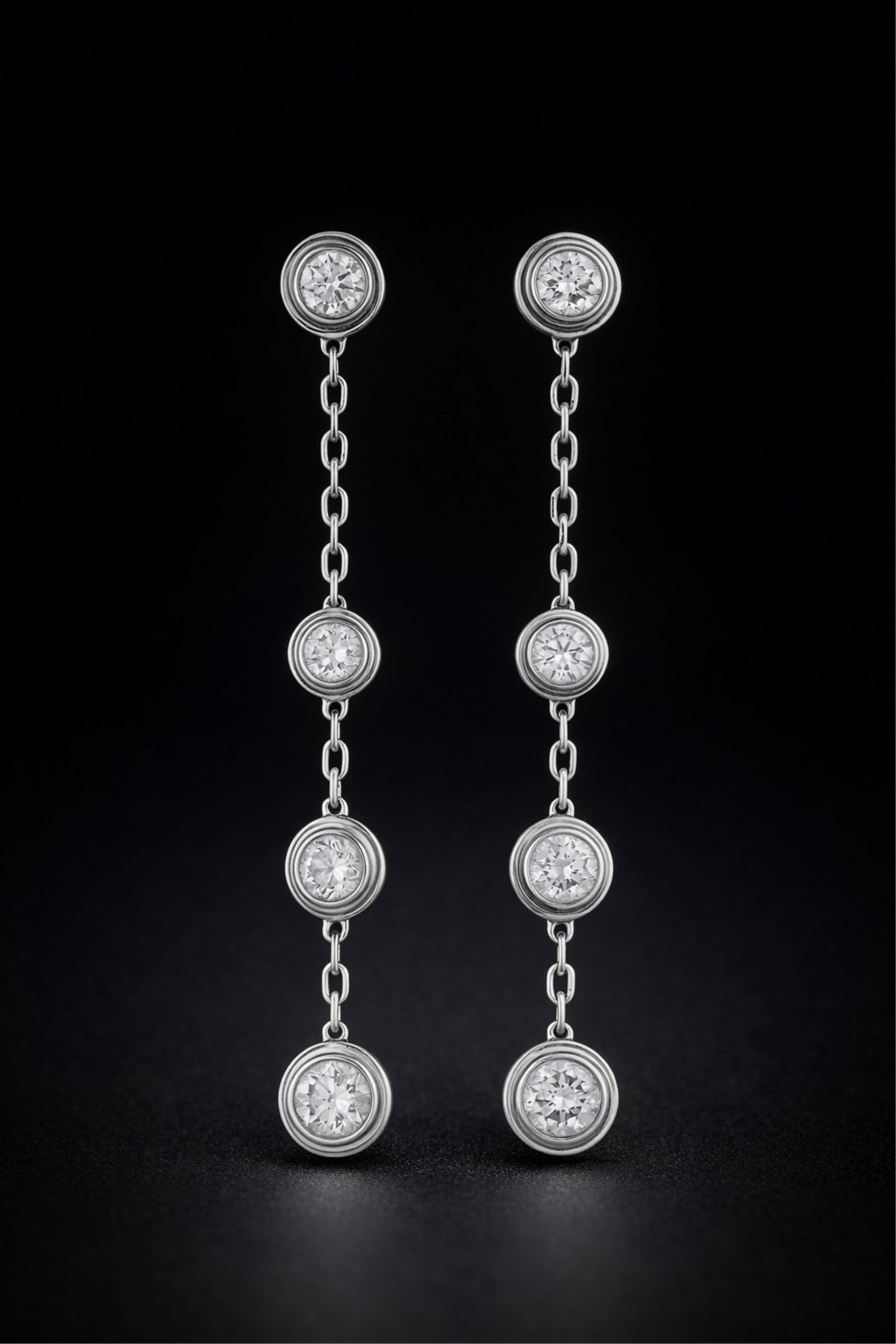 Cartier 18K White Gold Diamond Drop Earrings, signed: Keywords: 18k white gold, diamond drop earrings, luxury jewelry, brilliant-cut diamonds, French fine jewelry, pendant earrings, fashion, accessoriesElegant pair of signed Cartier diamond pendant earri