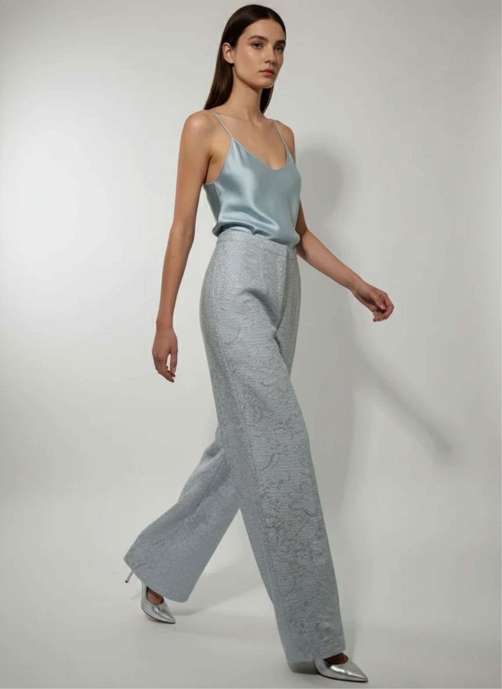 Joaquin J. Perez, Wide Leg Blue Pants with Metallic Silver Floral Brocade Pattern: Keywords: Art Deco Revival, Modern Glamour, Contemporary Couture, tailored trousers, palazzo silhouette, high-waist tailoring, runway presentation, evening wear Fashion, luxury fashion, designer appar