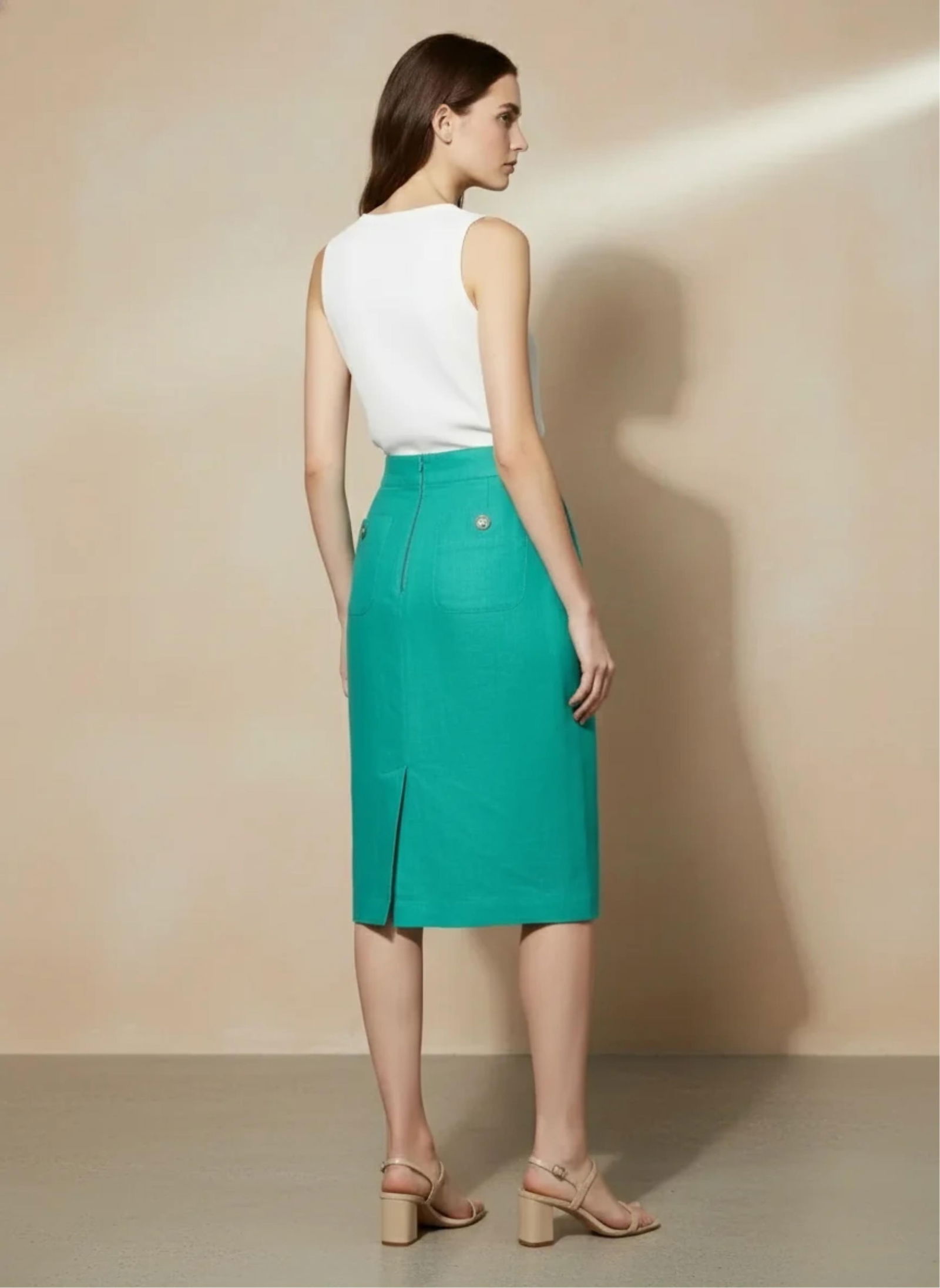 Louis Feraud, Teal Pencil Skirt Below the Knee Length: Keywords: Mid-Century Modern Fashion, Parisian Couture Influence, European Designer Wear, Tailored Silhouette, Structured Waistline, High-Waist Cut, Fitted Skirt Shape, Knee-Grazing Hemline, Back Vent