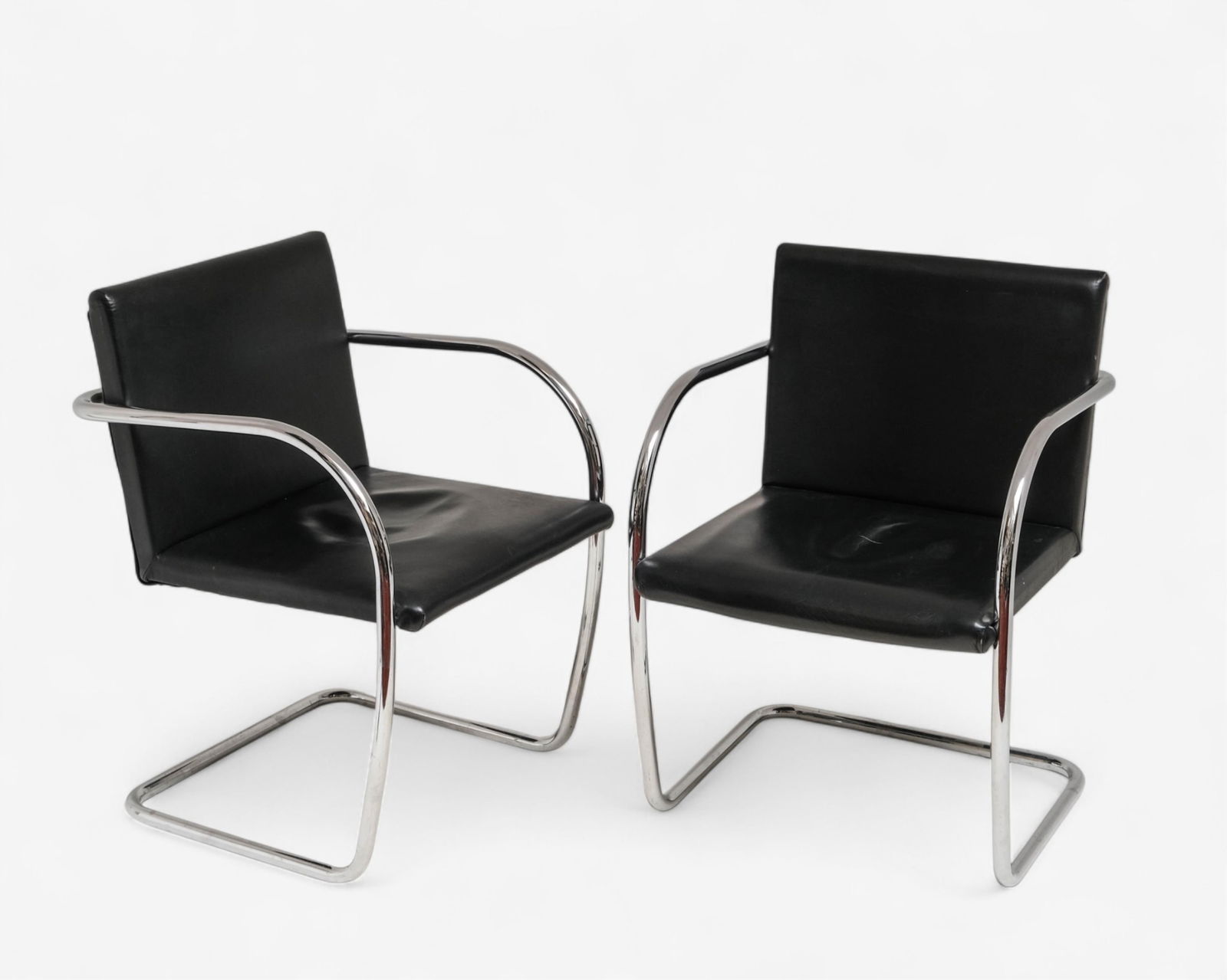 Mies van der Rohe Pair of Brno-style Armchairs After 1928 Design: Keywords: No reserve, modernist furniture, cantilever chairs, faux leather, mid-century style, minimalist seating, 1920s design, contemporary production, architectural furnitureSummary:Mies van der Ro