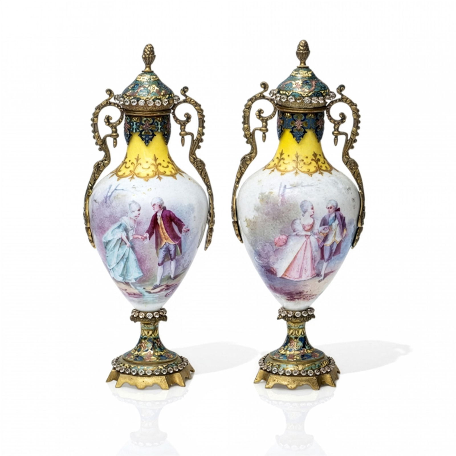 France, c. 1900 Sevres Hand Painted Porcelain & Cloisonne Champleve Enamel Urns (Pair): Keywords: Rococo revival decorative arts, Louis XVI style influence, Belle Époque French porcelain, Neoclassical revival design, 19th Century European luxury, Romantic period decorative tradition,