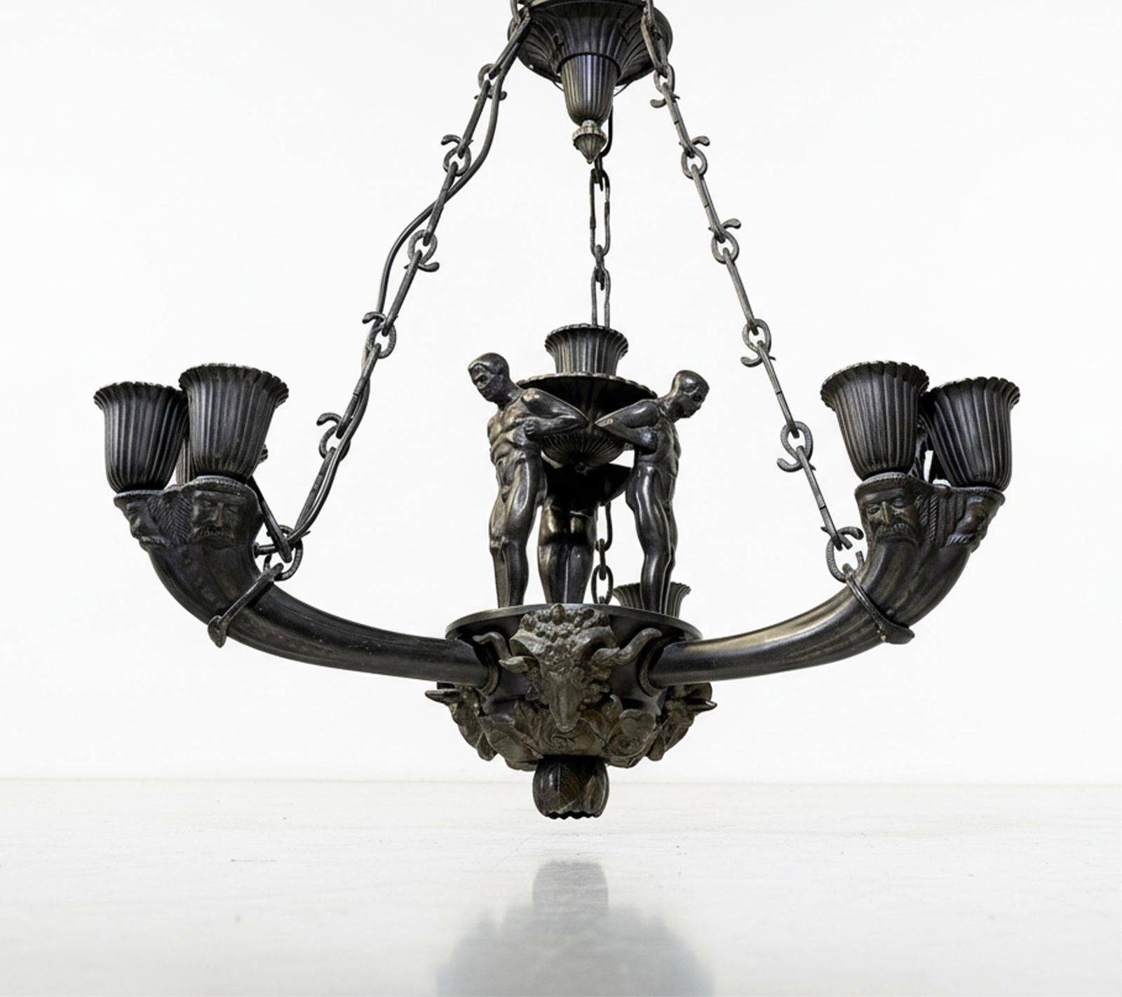Important 10- light German Patinated Bronze Ceiling Lamp: Keywords: Art Deco, Neoclassical Revival, Early 20th Century, Mythic Male Figures, Multi-Light Structure, Ornamental Bobeches, Ceiling Chandelier, Historic Interior Lighting, Period-Inspired DécorSum