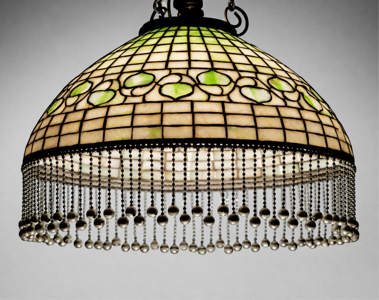 Louis Comfort Tiffany Leaded Glass Hanging Dome Pendant Lamp, Signed, c. 1900: Keywords: Art Nouveau, Tiffany Studios, Tiffany New York, leaded glass shade, Tiffany art glass, Lillian Nassau, American lighting, early 20th century, dome shade, pendant lamp, bronze fitterSummary:R