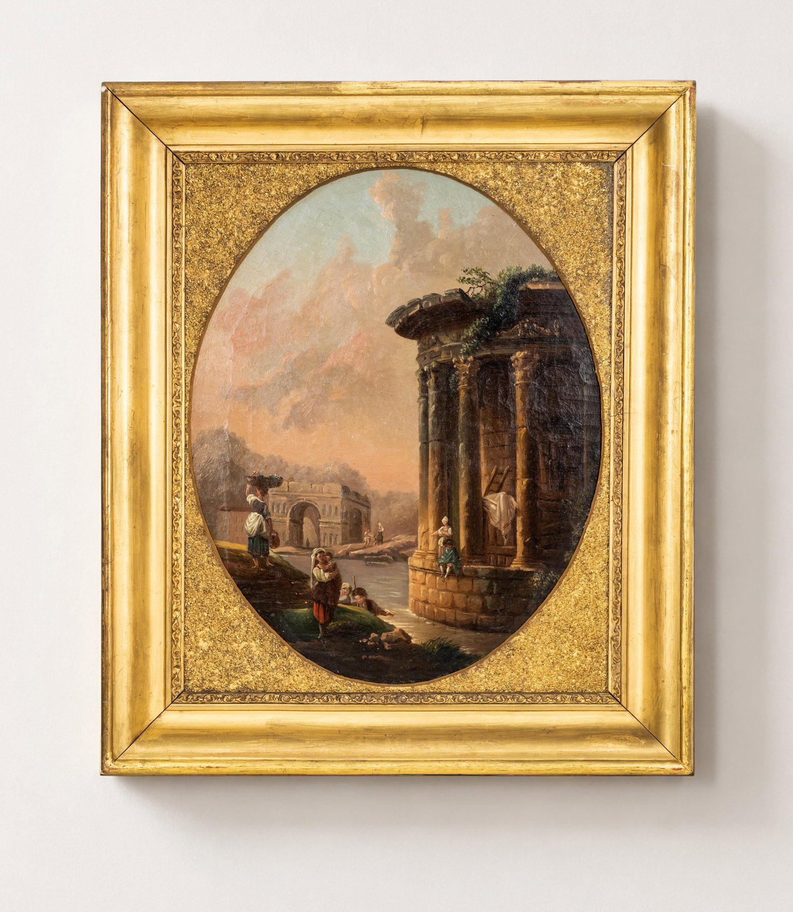 After Hubert Robert, The Temple of Vesta in Tivoli with Figures, Oval Oil on Canvas Painting: Keywords: Grand Tour, Neoclassical, 18th Century Style, Romanticism, French School, Italianate view, architectural ruins, classical columns, riverside scene, pastoral figures, historic landscape, capr