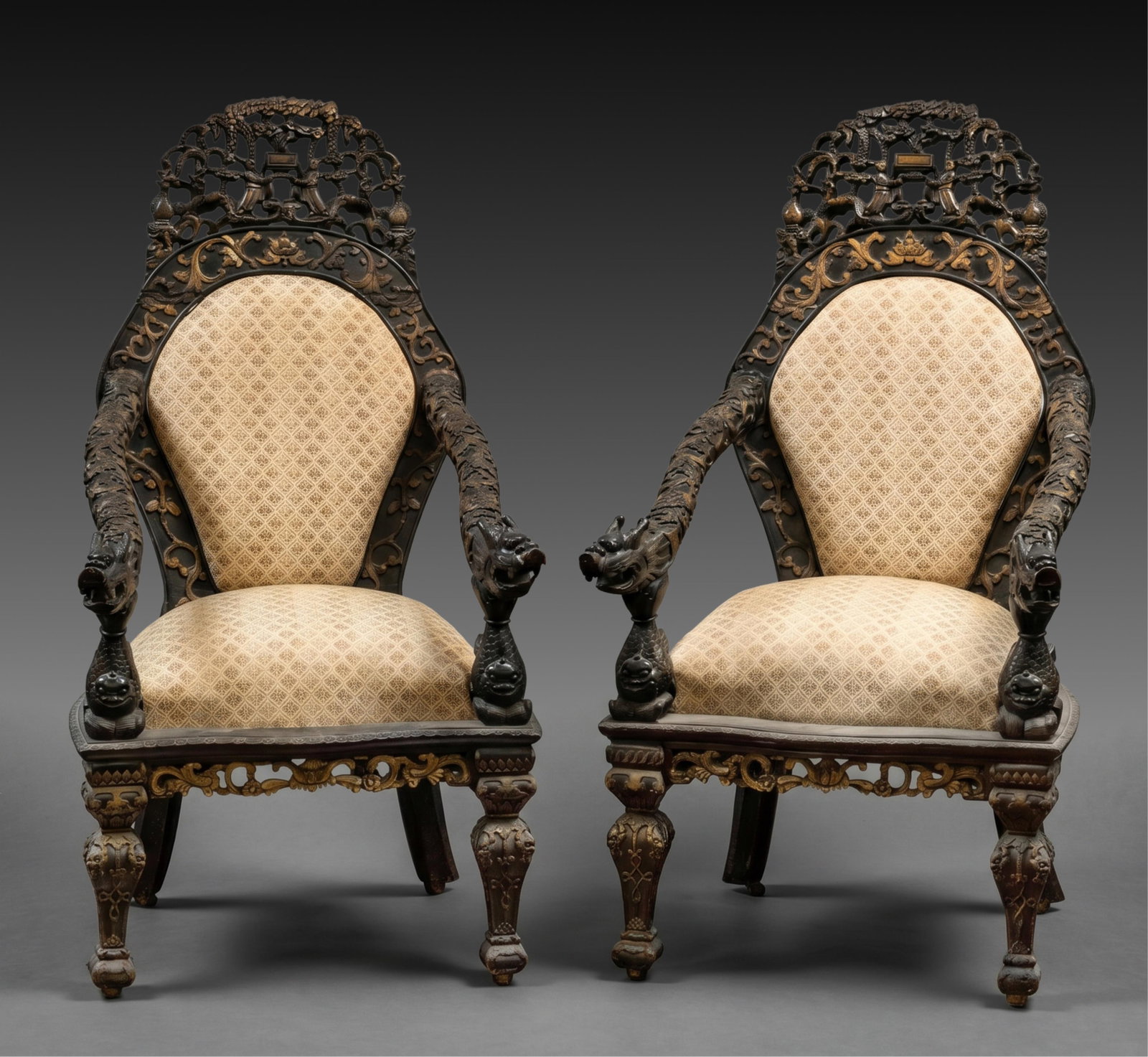 Pair of Heavily Carved Ceremonial Throne Armchairs, Antique and signed: Keywords: lacquered dark finish, mythological creature motif, Southeast Asian craftsmanship, imperial court aesthetic, ancestral hall furniture Summary: Pair of heavily carved antique ceremonial thron