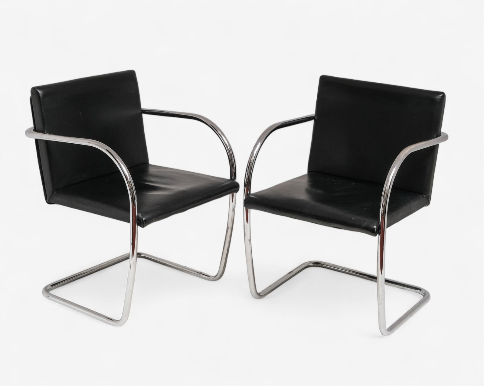 Pair of Brno-Style Armchairs After Mies van der Rohe: Keywords: No reserve, modernist furniture, cantilever chairs, faux leather, mid-century style, minimalist seating, 1920s design, contemporary production, architectural furniture Summary: Pair of Brno-