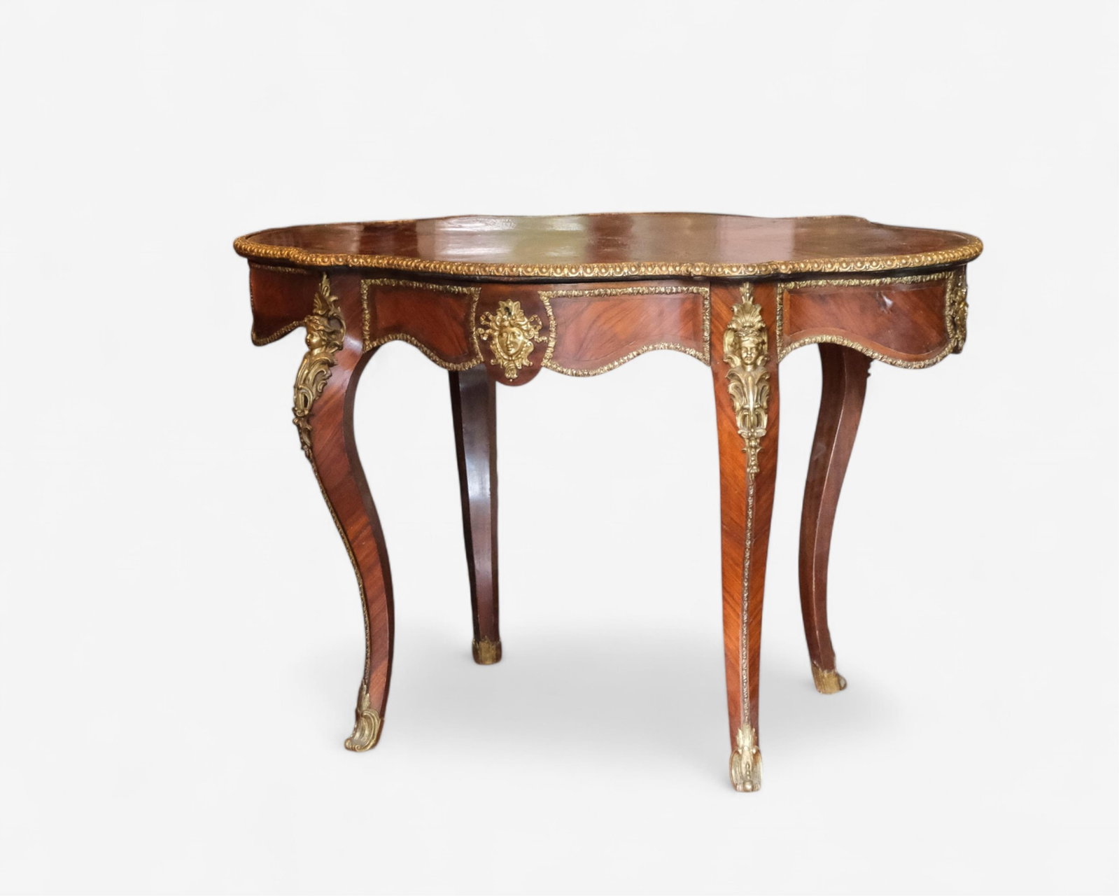 Louis XV Style Kingwood Center Table with Bronze Mounts, 19th Century: Keywords: Napoleon III, kingwood,with inlay and ormolu, bronze mounts, putti, masks, 19th century, Louis XV style, antique French furniture, center table Summary: Louis XV Antique French kingwood vene
