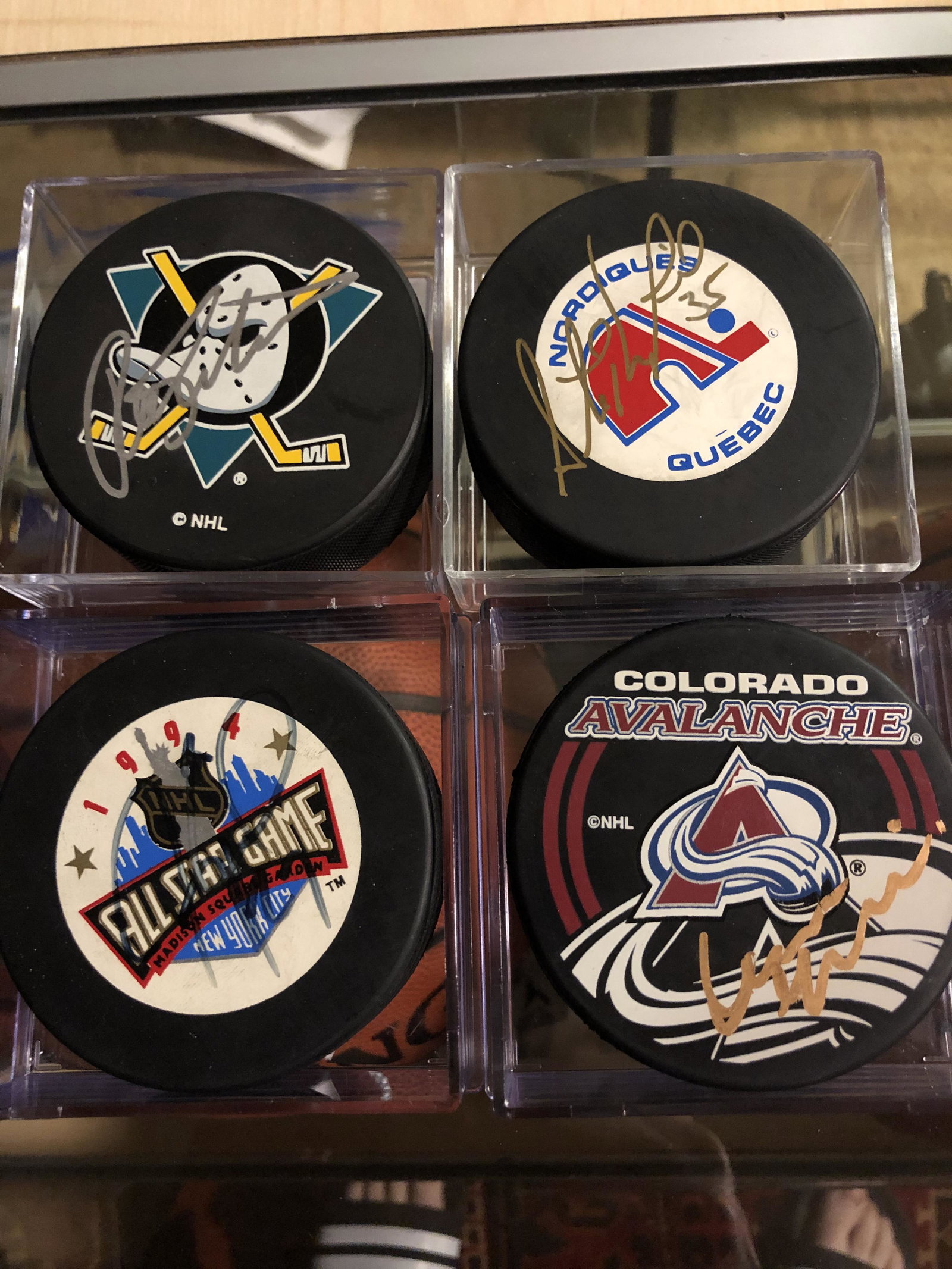 Lot of 4 Autographed NHL Stars Pucks: Lot of four Autographed NHL Stars Pucks: Jeremy Roenick (1994 NHL All Star Game), Stephane Fiset (Quebec Nordiques), Ron Tugnutt (Anaheim Mighty Ducks), and Mike Ricci (Colorado Avalanche).