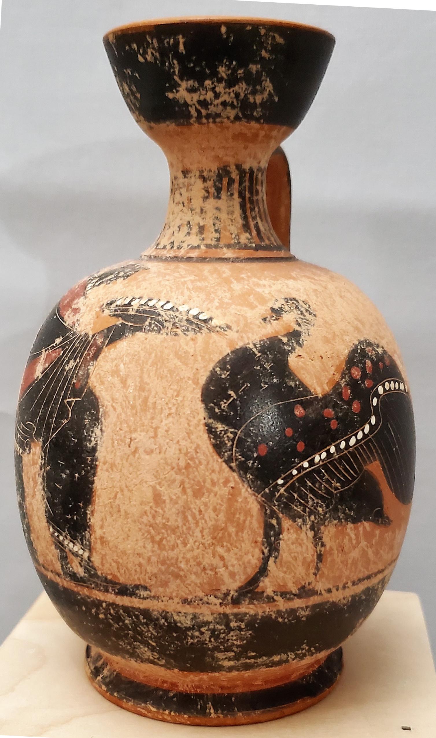 Etruscan Squat Hydria: An Etruscan squat hydria, one handle hydria, painted with a figure feeding a large bird, 6th Century BC, 5 1/2 in. tall