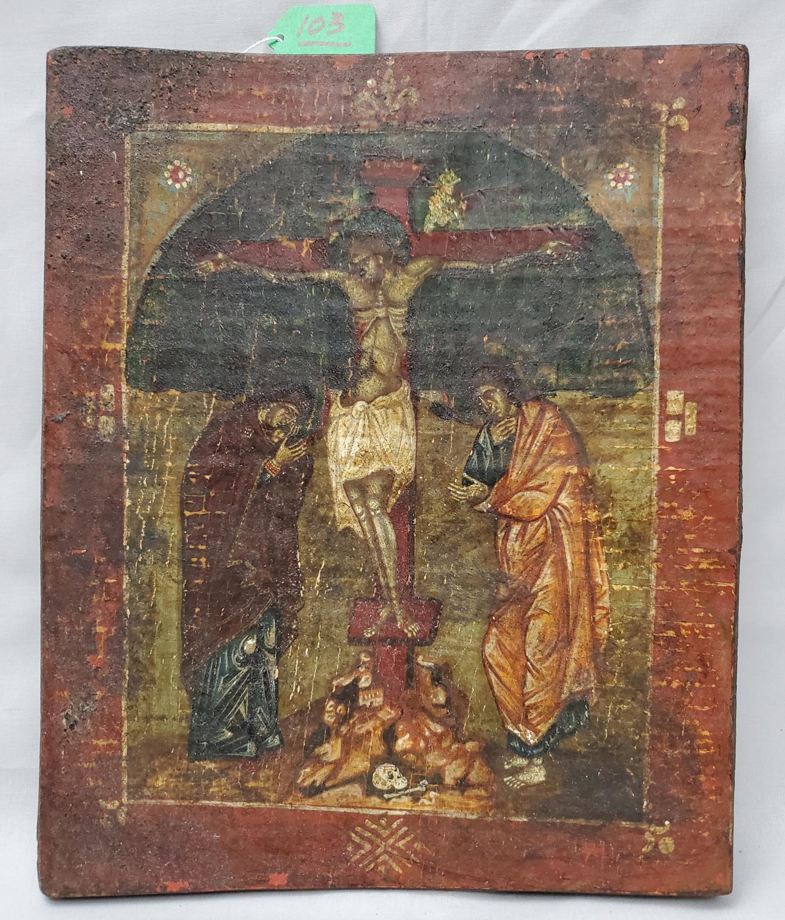 Russian Icon of the Crucifixion: A Russian icon of the Crucifixion, painted on canvas and later stretched on a wood board 12 ¾ in. x 10 5/8 in.