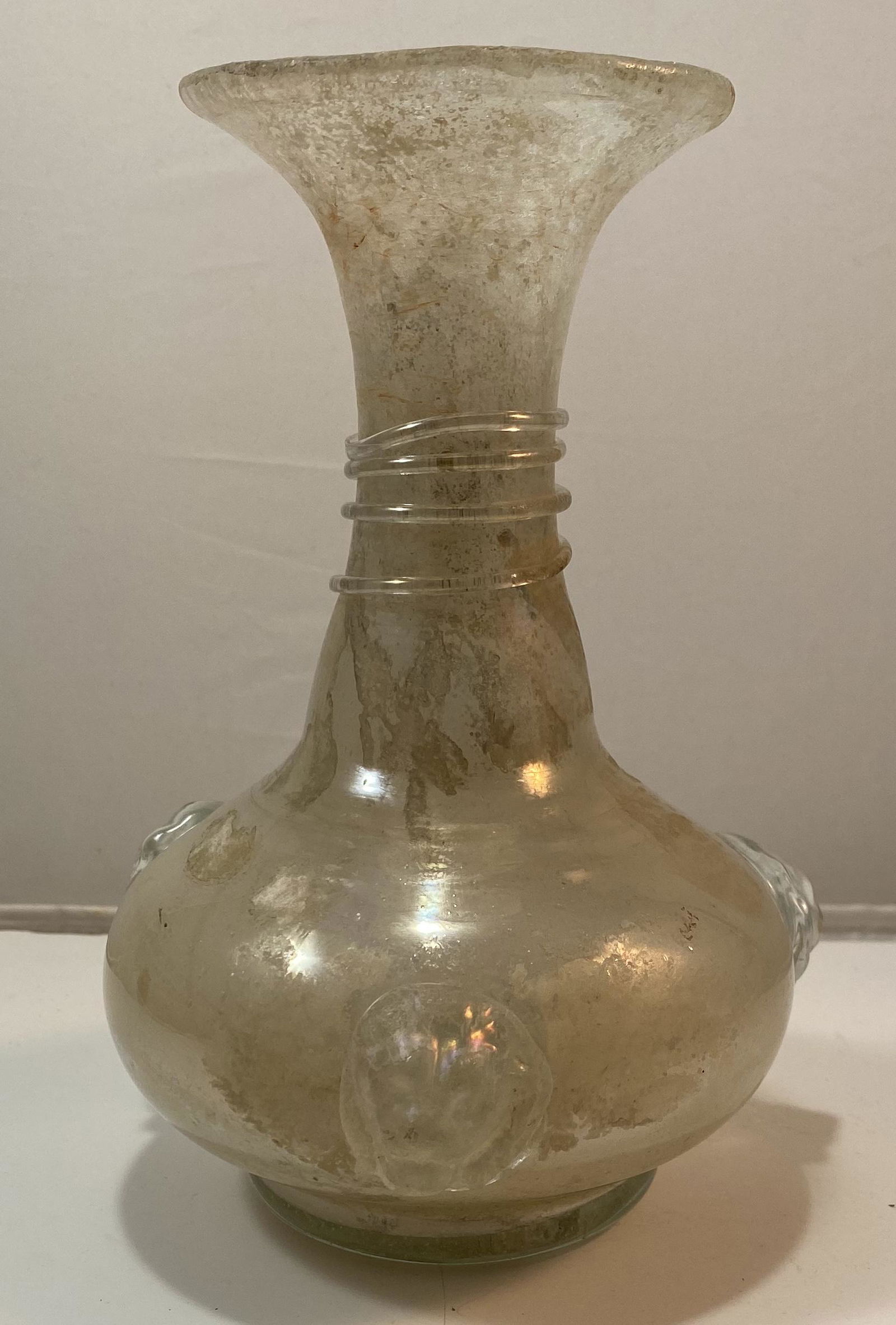 Antique Venetian Art Glass Vase: Italian Antique Venetian Art Glass in the â€œscaffiatto” style, and with lion head protomes all around. 7 1/4 high x 5 dia.