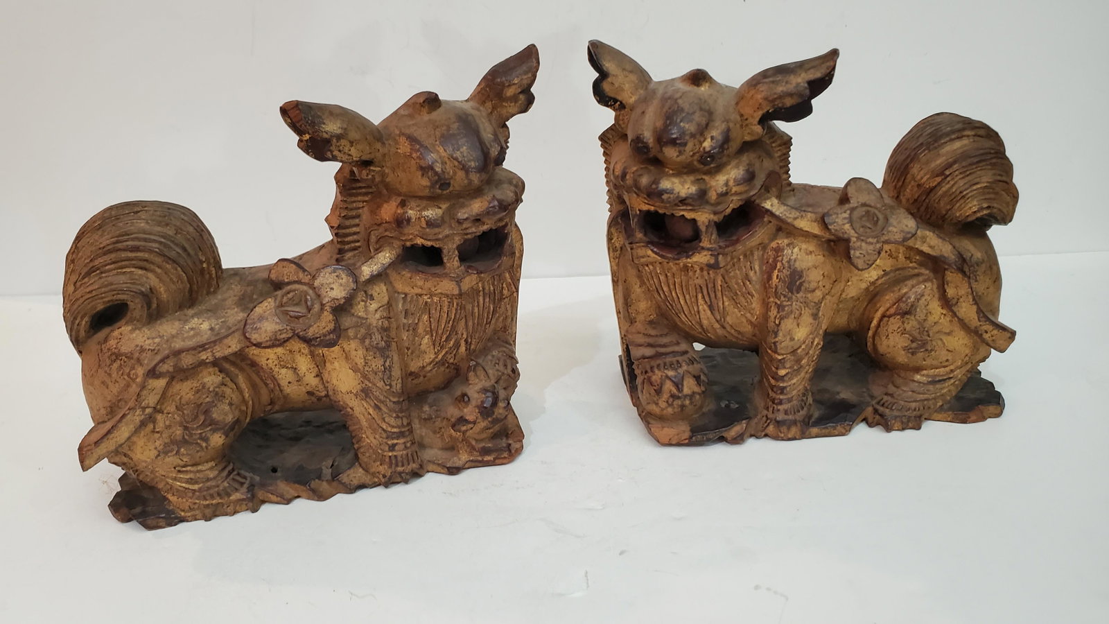 Pair of Carved Wood Foo Dogs: China. Pair of gilt carved wood foo dogs, 19 th Century, each 6 x 7 x 3.