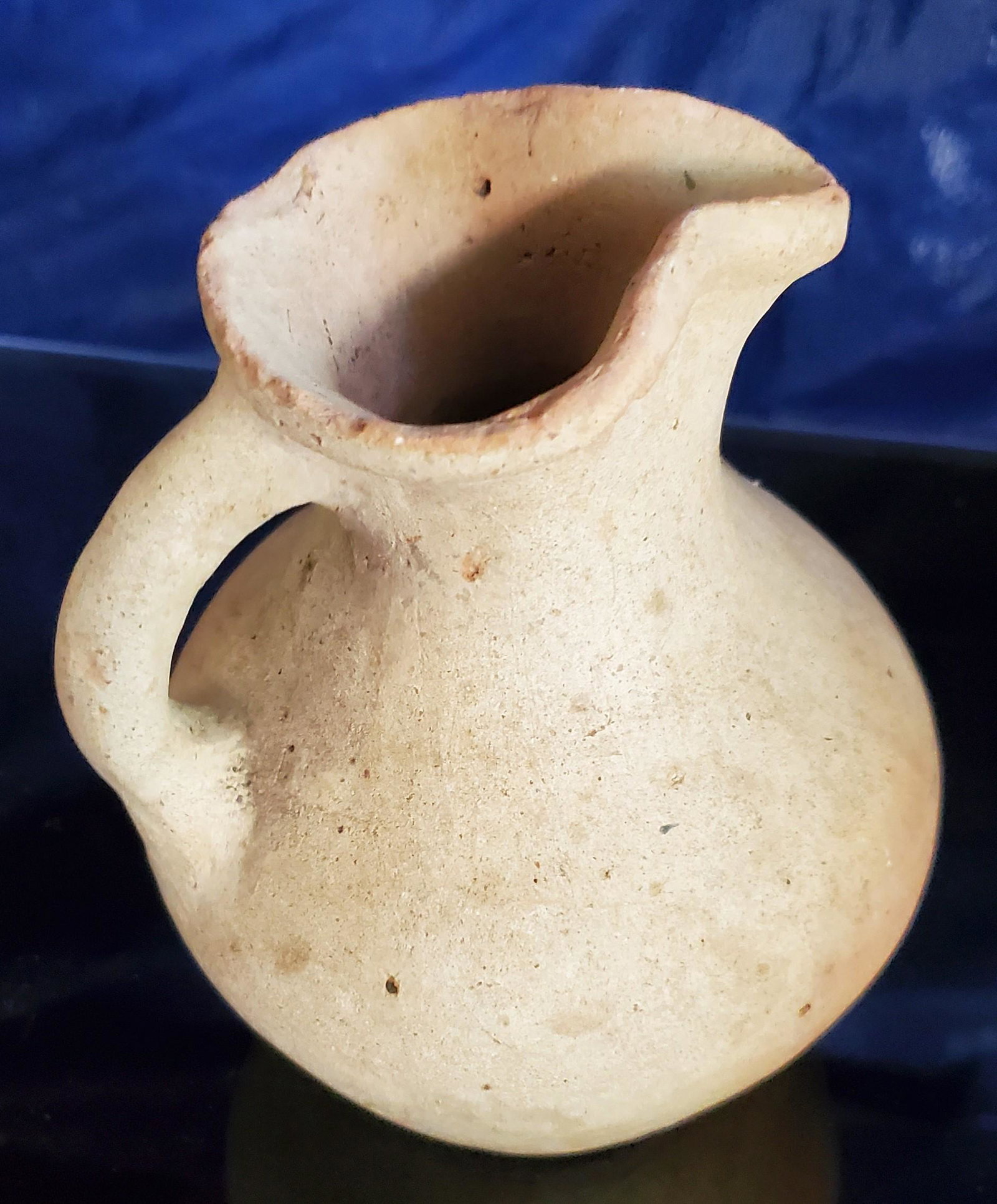 Near Eastern Trefoil Hydra: Ancient Near East, Early trefoil Hydria, unpainted, first millennium BC., 6 in. high x 4 ½ in. diameter.