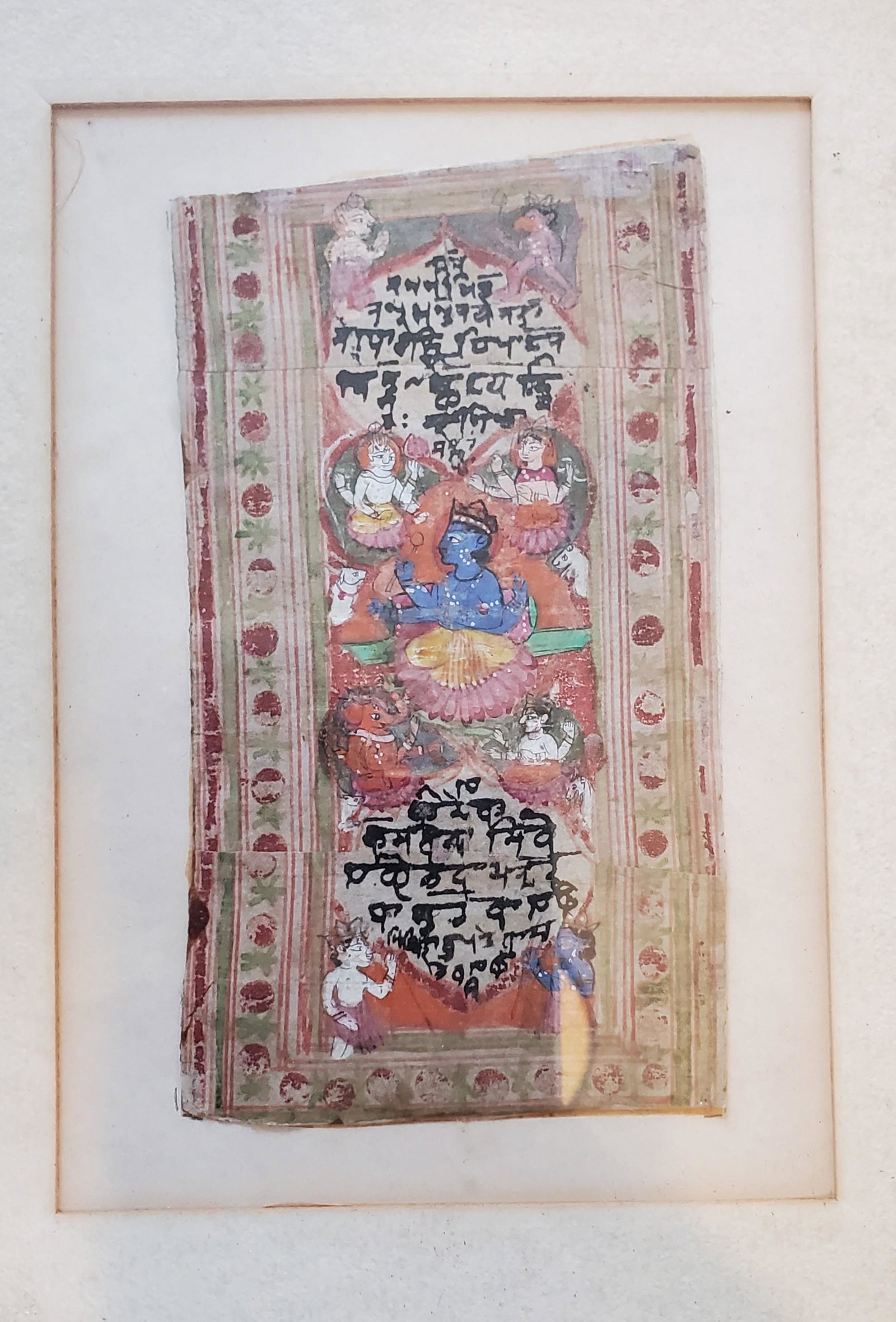 Tibetan Buddhist Painting: Tibetan Painting. A good Tibetan painted depiction of a god seated on a lotus flower and surrounded by several figures, framed. 6 ¾ x 3 ¼ for painting only, without frame.