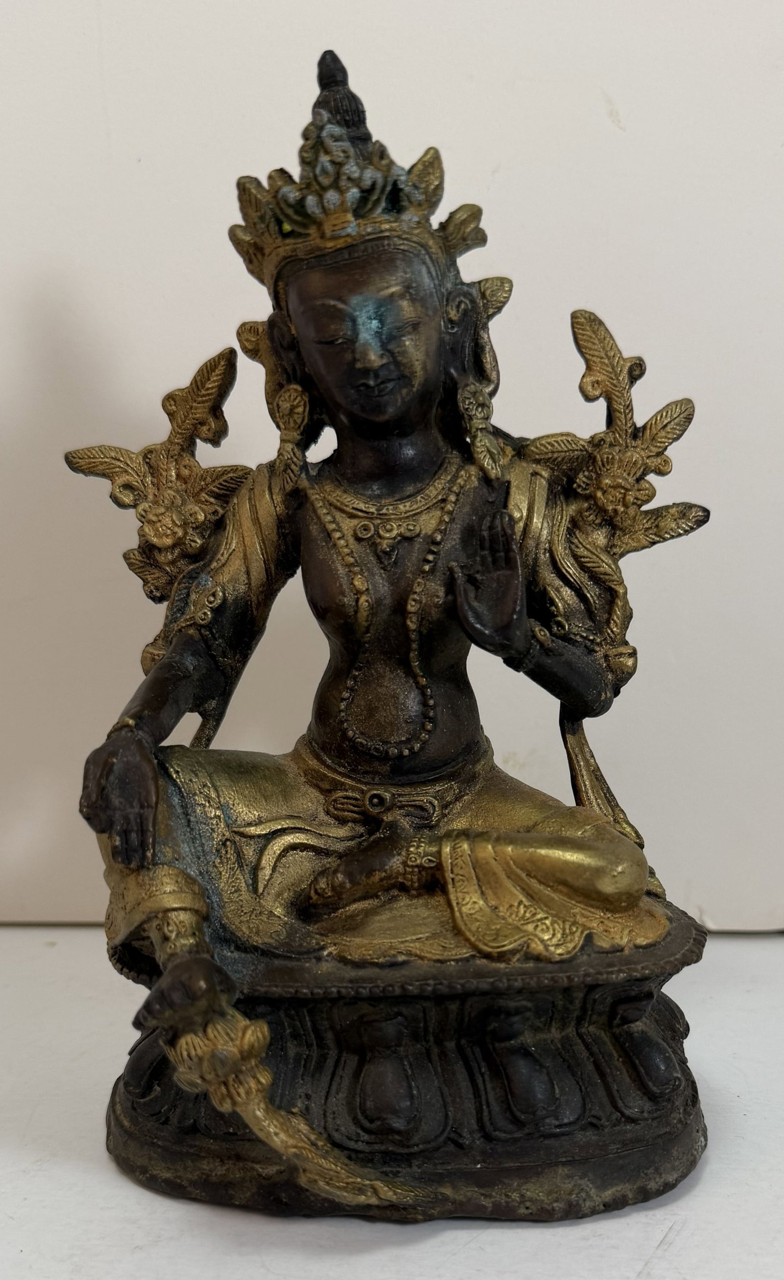 Sino Tibetan Bronze Seated Figure of Tara: Height: 6 1/2 inches, Width: 4 1/4 inches, Depth: 3 3/8 inches. Weight: 1 lb. 11 oz.