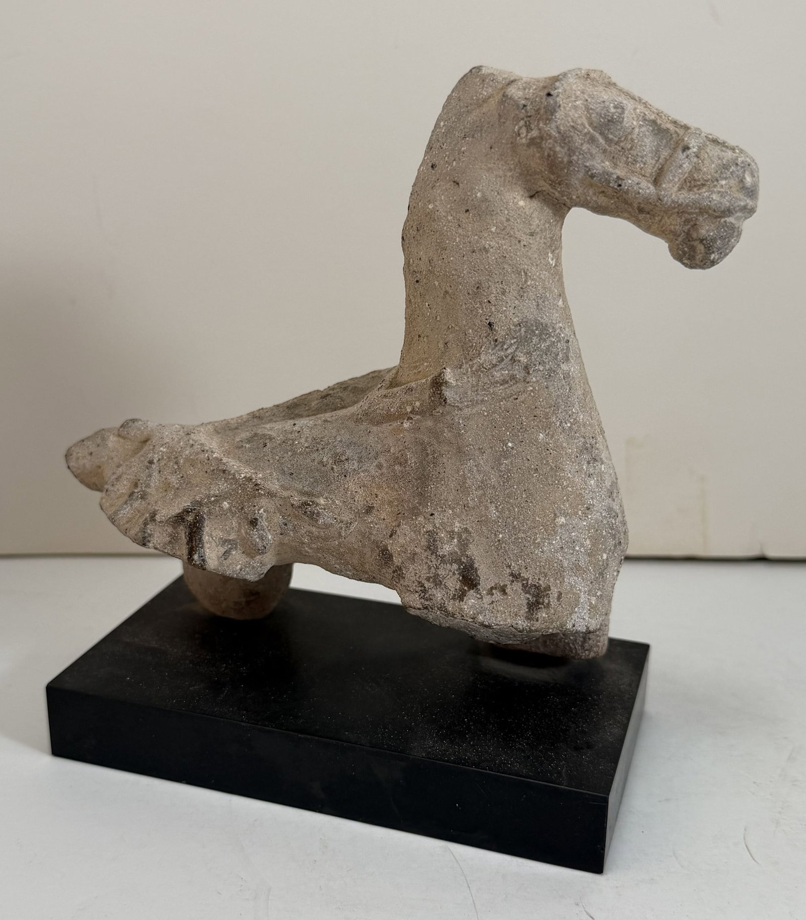 Rare Celtic or Gallic Carved Stone Caparisoned Horse, 1st-3rd C AD: This rare figure is from the Gallo Roman period and it is carved in the round, the surface with some chips and losses to the carving, possibly originally a toy that would have had wheels affixed to th