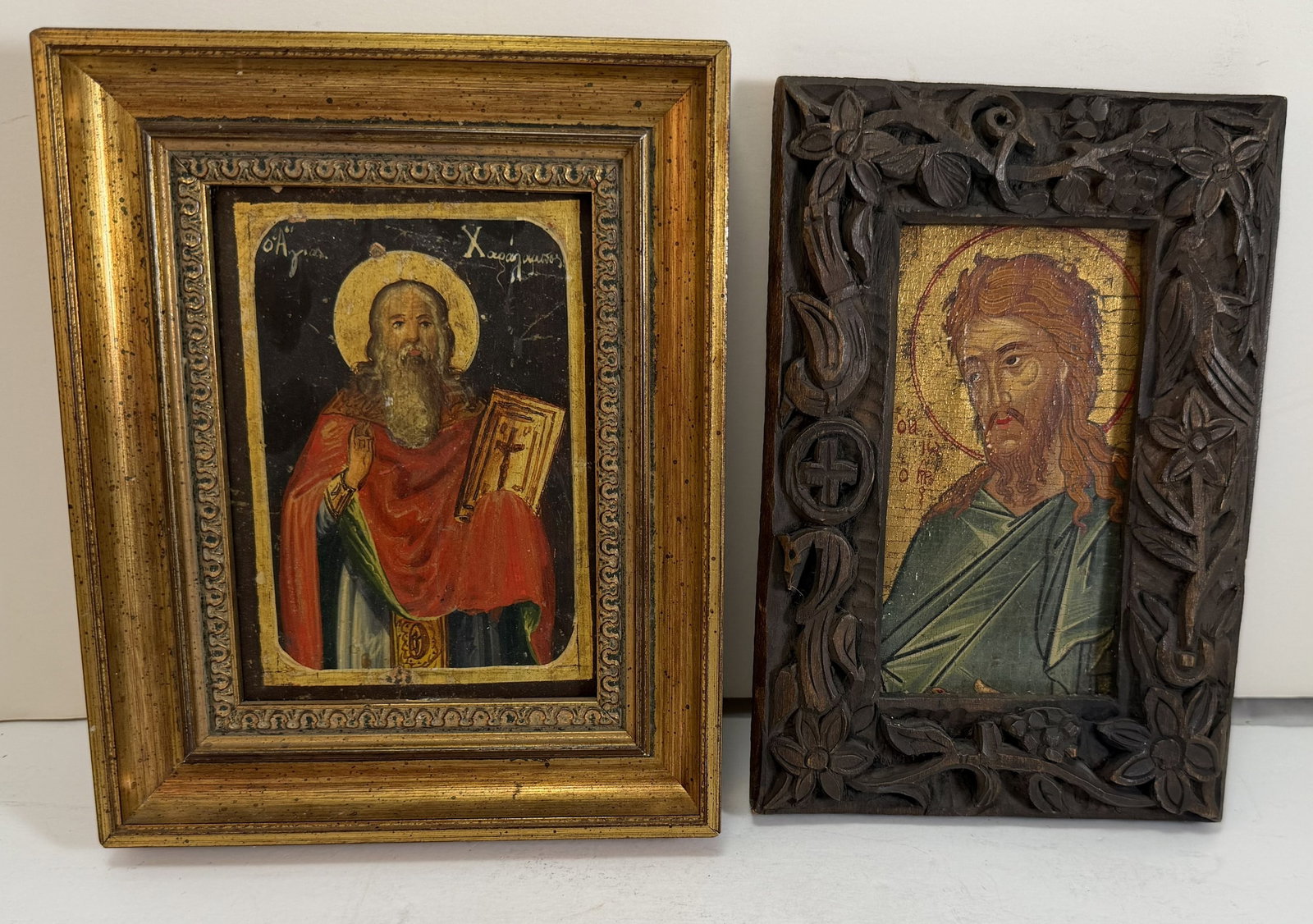 Two Small Greek Icons of Saints: A small icon of St John the Baptist in a hand carved frame, together with a icon of St. Charalamp, each egg tempera on wood panel. St John the Baptist Image 4 3/8 by 2 1/4 inches, overall 6 7/8 by 4 3