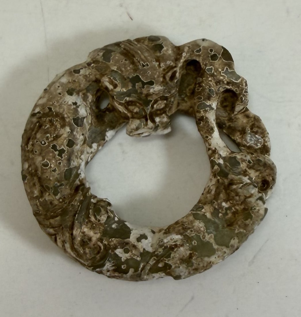 Chinese Carved Jade Circular Dragon: The jade a green color. Diameter: 2 1/4 inches, approx. 1/2 inch deep. Weight: 1.40 oz.