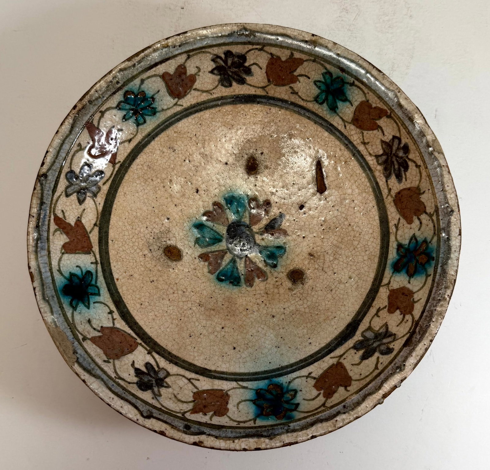 Ottoman Empire Iznik Glazed Ceramic Dish, 17th / early 18th Century: Small chips along the edges and two filled chips. DDiameter: 8 3/4 inches, Depth: 2 inches. Weight: 1 lb. 3 oz.
