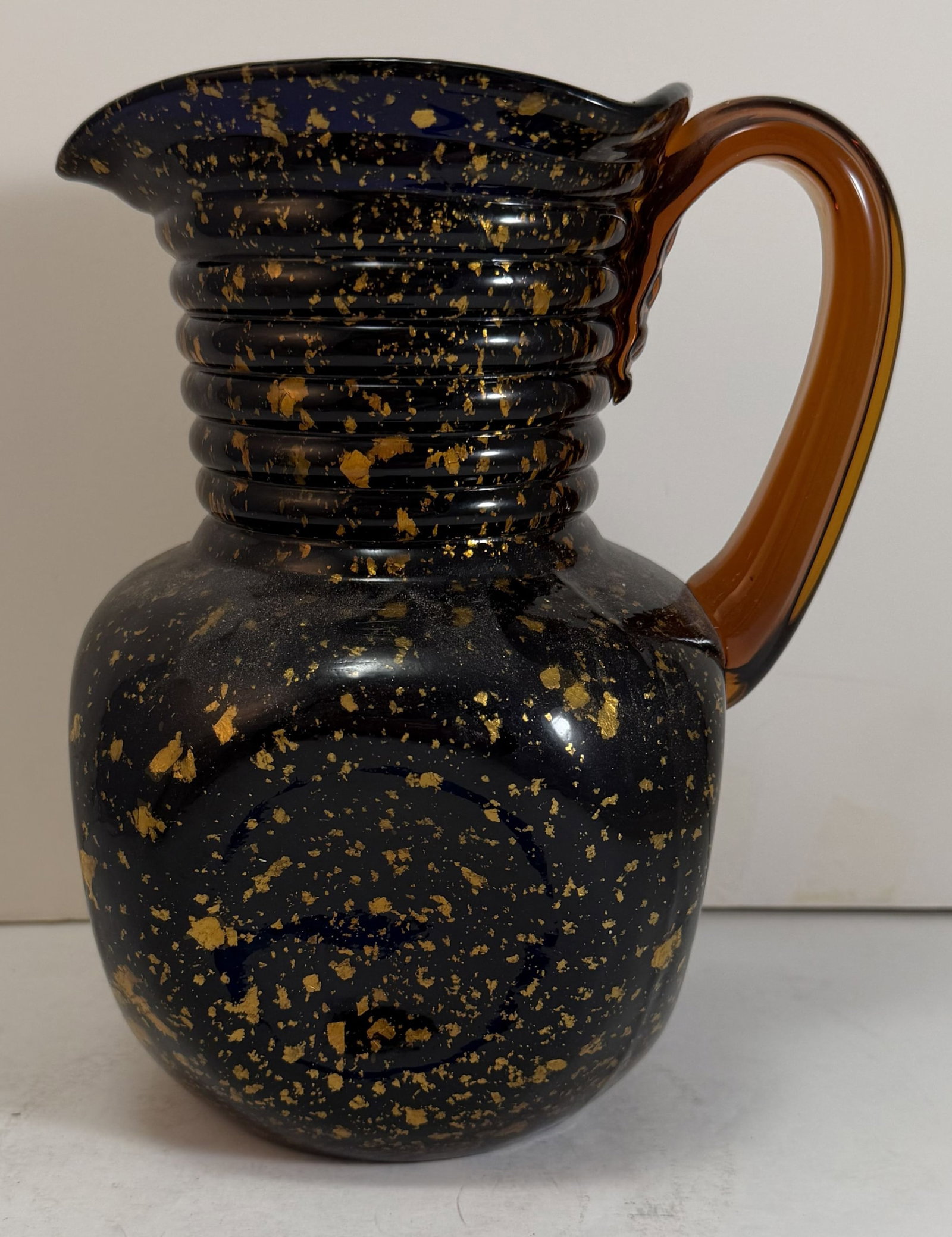 Hobbs Spangled Ware Pitcher: The glass decorated with mica flakes, attributed to Hobbs. Height: 8 inches, Width: 6 1/2 inches, Depth: 5 inches. Weight: 2 lbs. 5 oz.
