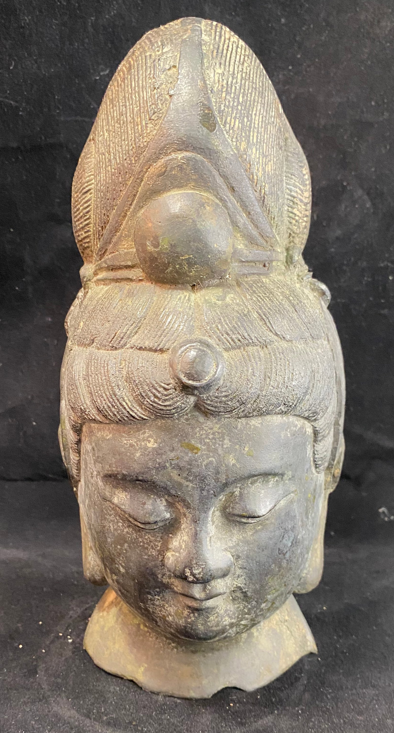 Chinese Bronze Buddha Head: A head from a large figure of a bodhisattva. Height: 9 3/4 inches, Width: 4 1/2 inches, Depth: 5 inches. Weight: 4 lbs. 15 oz.