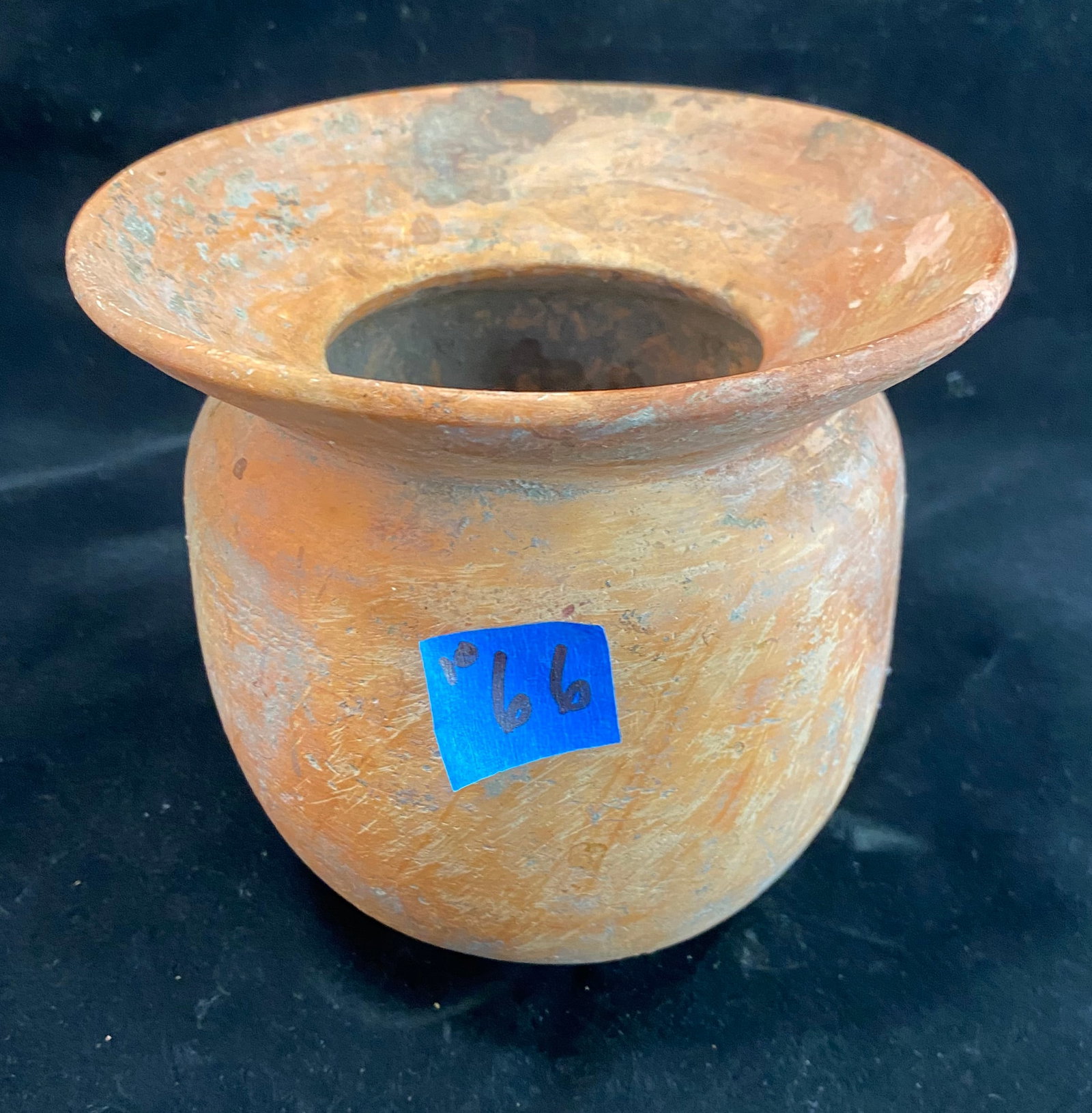 Ancient Terracotta Vessel: Ovoid form with a flared rim. Height: 6 inches Diameter: the rim 6 1/4 inches. Weight: 1 lb. 15 oz.