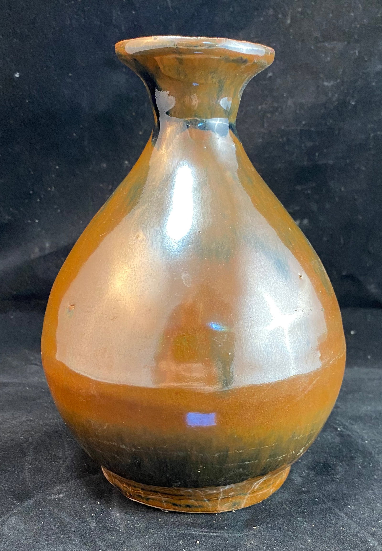 Chinese Antique Pear Form Brown Glazed Stoneware Vessel, Yuhuchunping: The vessel covered in a brown or persimmon glaze. Height: 6 1/2 inches, Diameter: 4 1/2 inches at the widest point. Weight: 1 lb. 2 oz. This item is at our New York location.