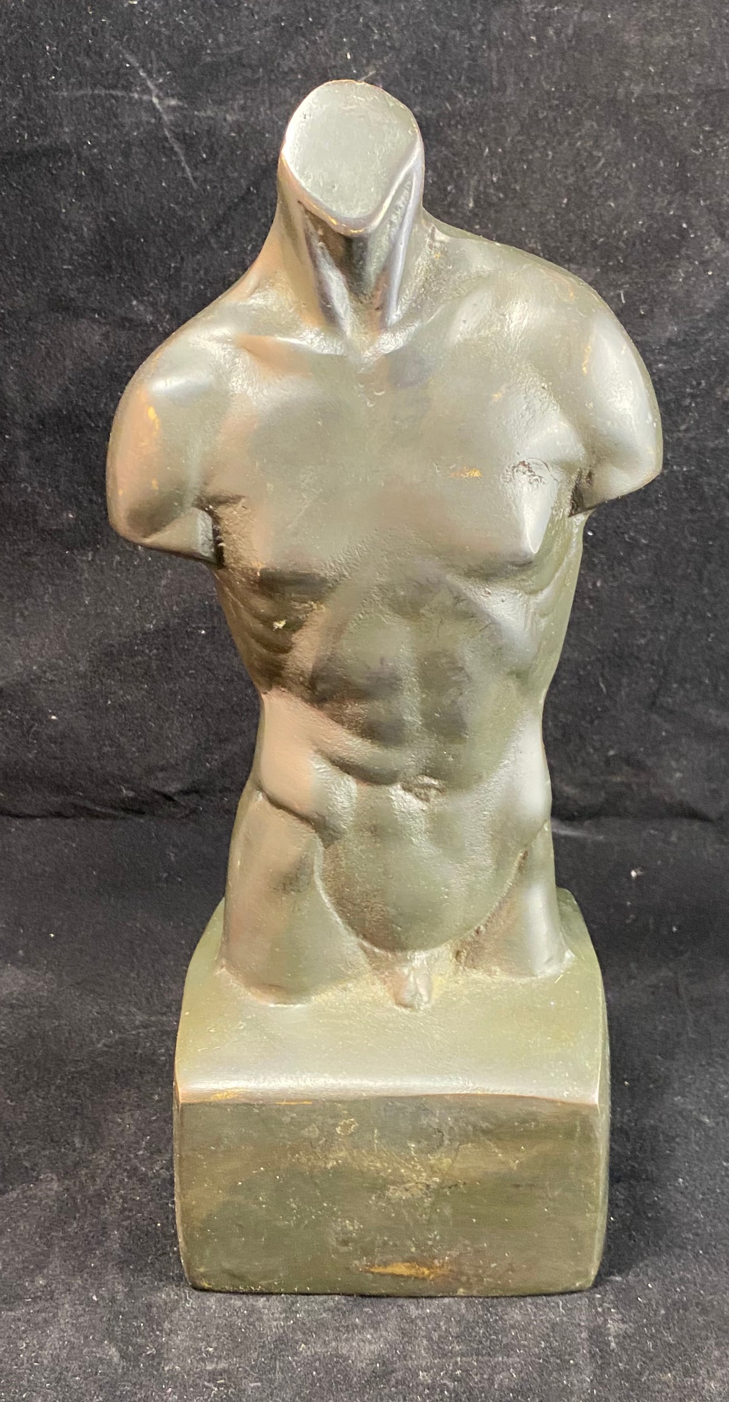 Male Torso, Patinated Bronze Model, early 20th Century: With a deep brown patination applied to the surface. Height: 9 inches, Width: 4 1/4 inches, Depth: 3 3/8. Weight: 2 lbs. 6 oz. This item is at our New York location.