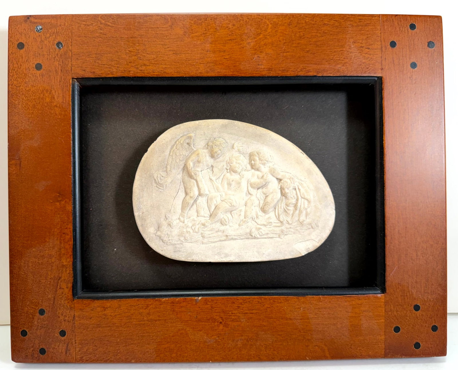 Three Italian Grand Tour Plaster Cast Intaglios: Each framed, including a pair framed in gilt wood and one larger intaglio with an inlaid wood frame, each depicting mythological scenes. The pair: each intaglio 1 1/2 by 2 1/4 inches, the frames 4