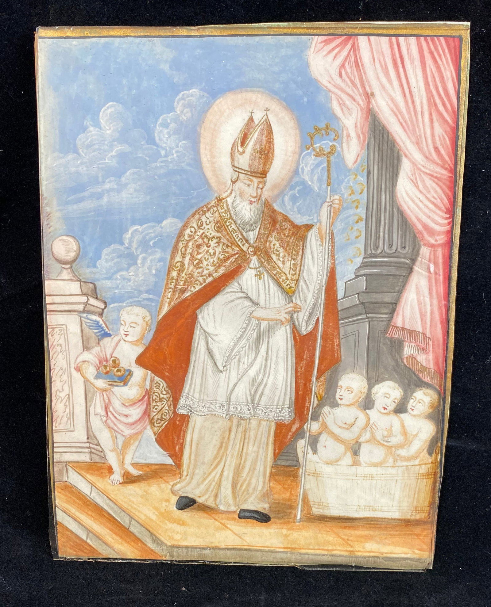 French Miniature of St. Nicholas, Gouache on Parchment, 17th Century: A scene of St. Nicholas in bishops attire, with a crozier and wearing a miter, rescuing three children from a pickling barrel. 7 1/4 by 5 3/4 inches. Weight: 5 oz. (With the glass). This item is at