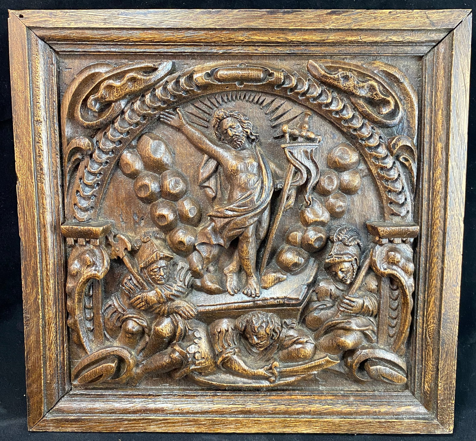 European Decorative Carved Oak Panel with the Resurrection, likely Flemish, 17th Century: Carved in high relief, once part of a larger piece of furniture and cut down in the 19th or early 20th Century. The panel 10 by 10 1/2 inches, the frame 12 1/2 by 13 inches. Weight: 2 lbs. 5 oz. This 