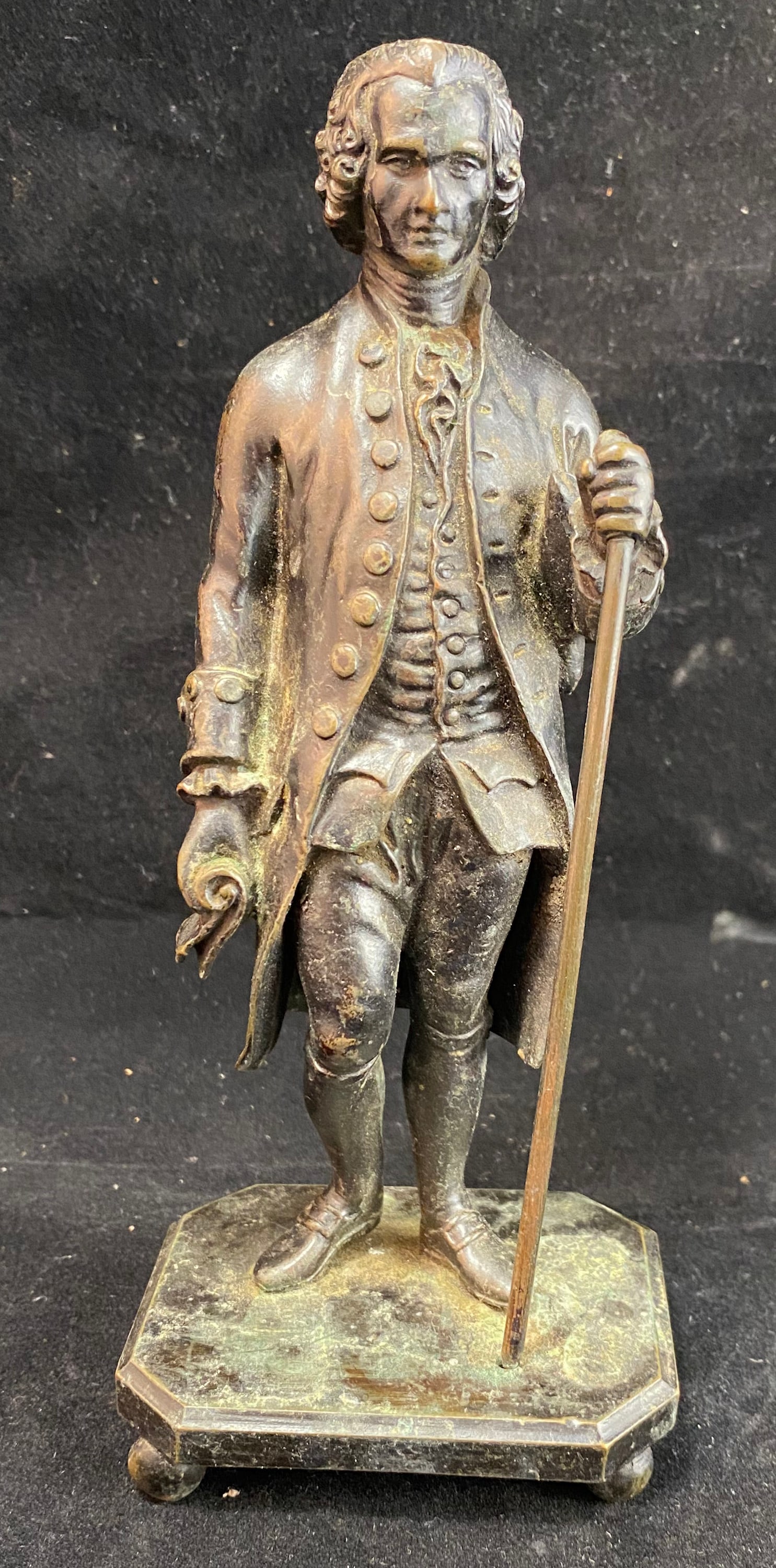 After Jean-Antoine Houdon, Jean-Jacques Rousseau, Patinated Bronze: Height: 7 inches, (The base 3 inches by 2 1/4 inches). Weight: 1 lb. 10 oz. This item is at our New York location.