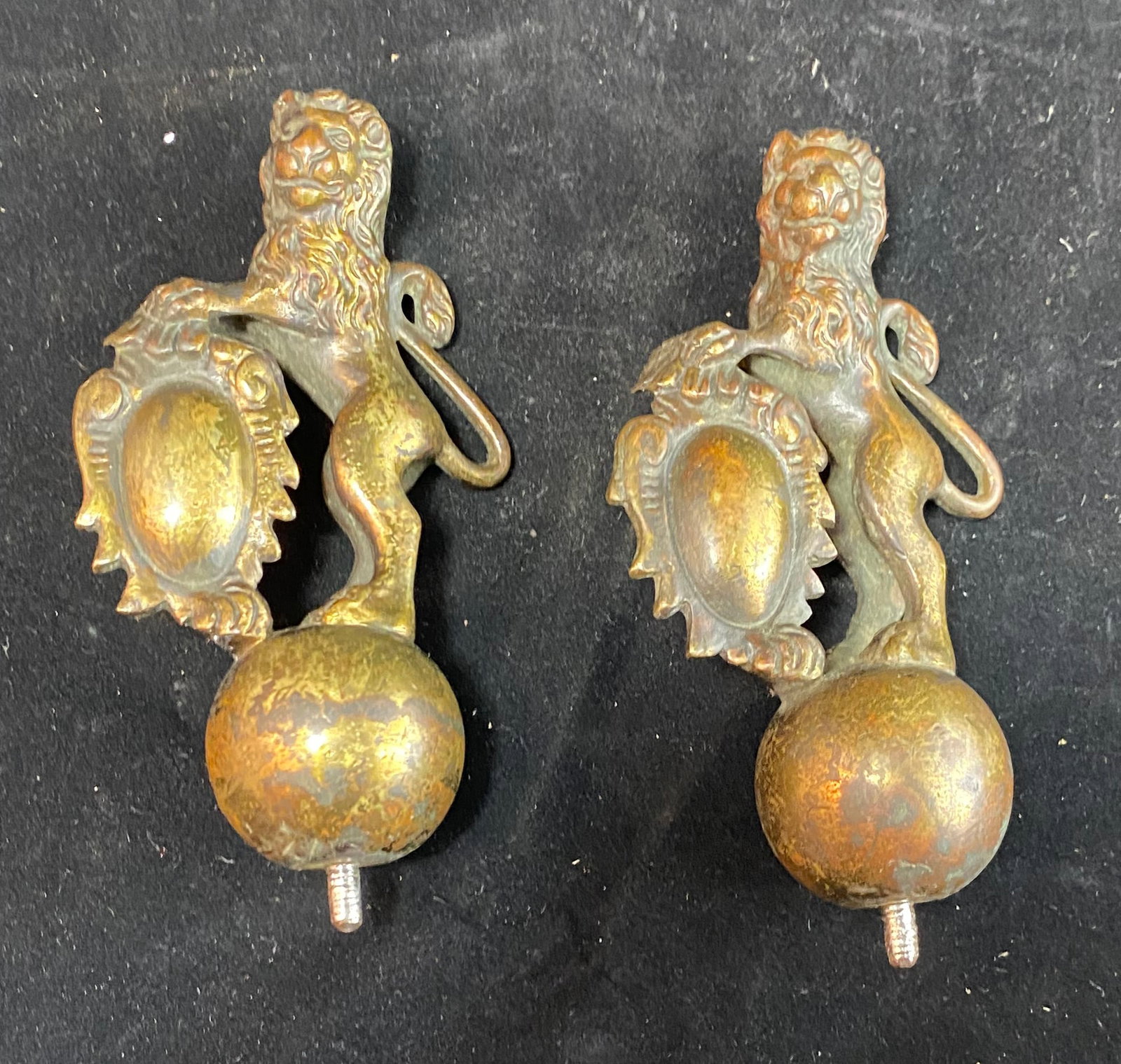 A Pair of Lion and Crest form Bronze Finials (1 of 3)