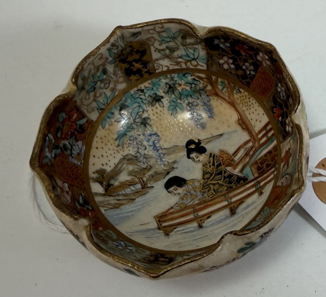 Miniature Japanese Satsuma Bowl with Foliate Rim, Signed, Meiji Period: With a mark on the underside, decorated with a mother and daughter. Some small nicks and wear to the rim. Diameter: 2 1/2 inches, Height: 1 3/8 inches. Weight: 1.6 oz. This item is at our New York loc
