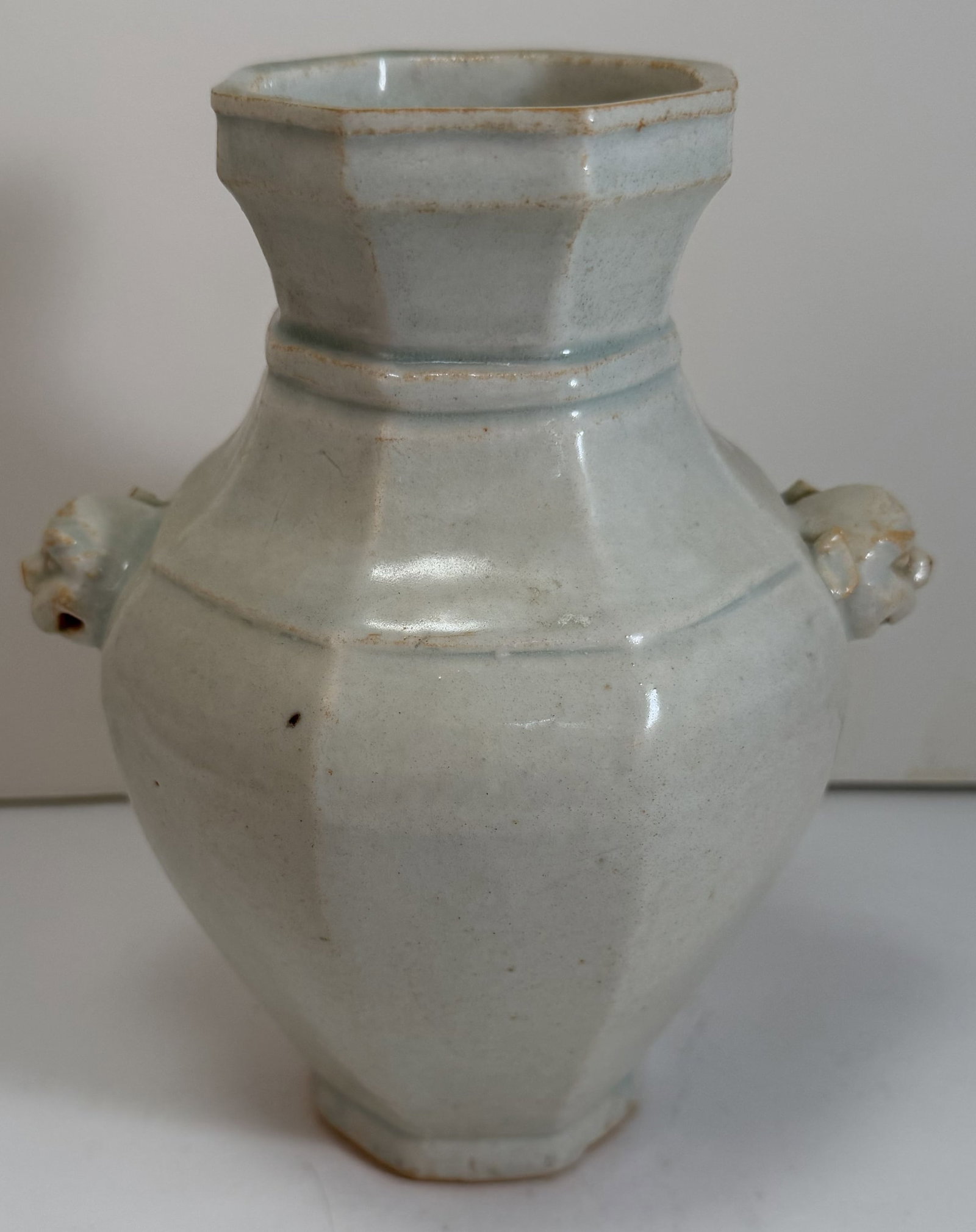 Rare Chinese Blue Glazed Baluster Vase with Lion Form Handles: With some flaking and light wear to the glaze along the edges, with some minute nicks, one lion lacking an ear, it is not broken, but it was not added when made. Height: 7 inches, Width: 6 inches at t