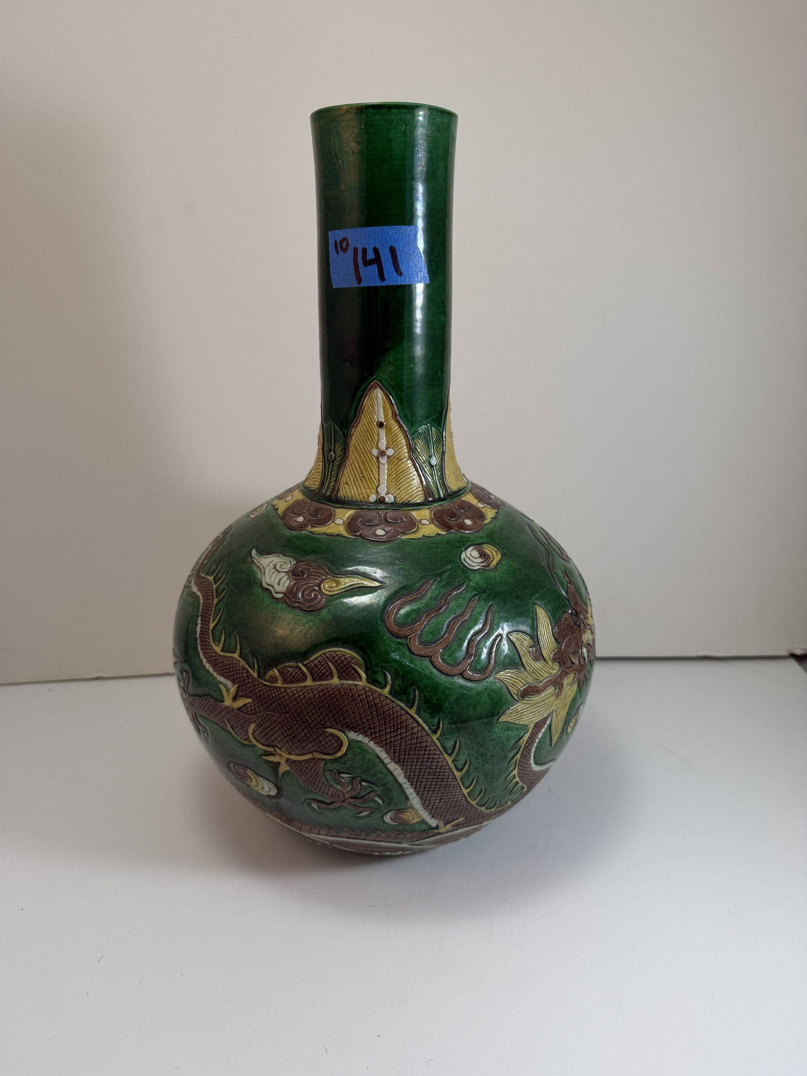 Chinese Green, Yellow and Aubergine Glazed Dragon Vase: With a Kangxi mark, possibly later. Height: 14 inches, Diameter: 8 3/4 inches. Weight: 6 lbs.
