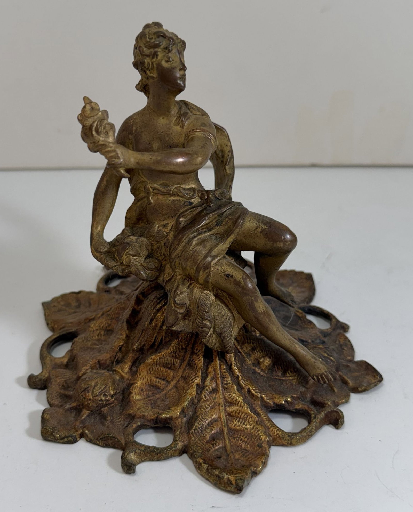 European Art Nouveau Bronze Figure of a Seated Lady, ca. 1880-1890: Possibly Liberty, with traces of gilding. 5 inches, the base 5 3/8 inches wide. Weight: 2 lbs. 5 oz.